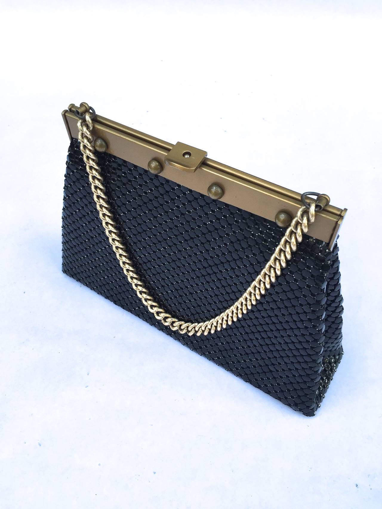 Whiting & Davis 70s black A-line mesh handbag with gold chain & 4 gold round studs near clasp. 
Measurements are:
11