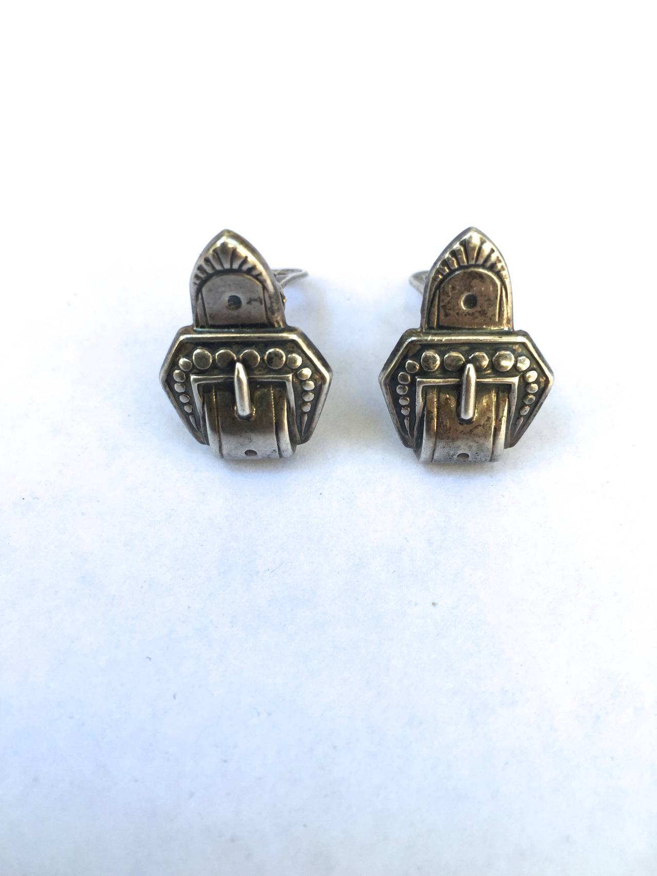 Marcel Boucher Parisina 1940s Mexican sterling silver clip earrings with buckle pattern. They are 1