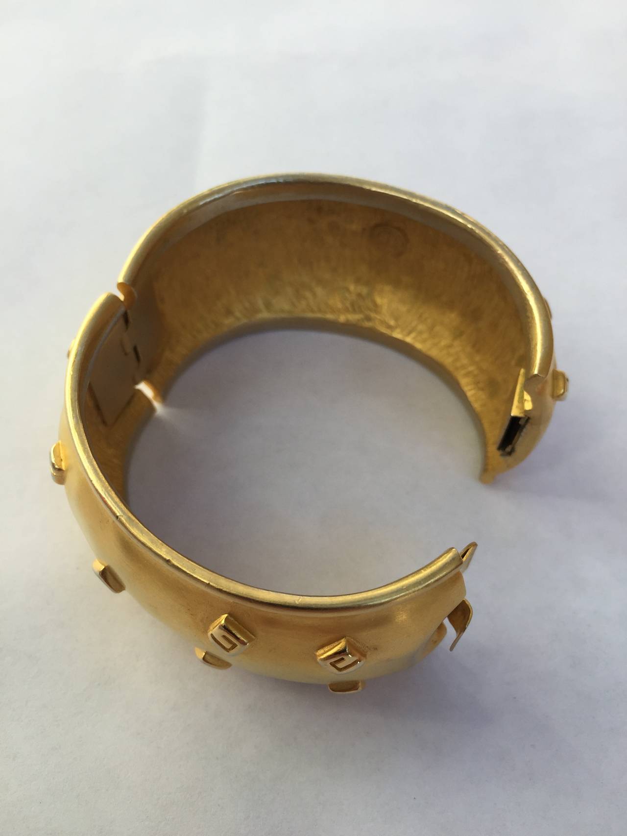 Aesthetic Movement Givenchy 1980s Logo Gold Cuff Bracelet. For Sale