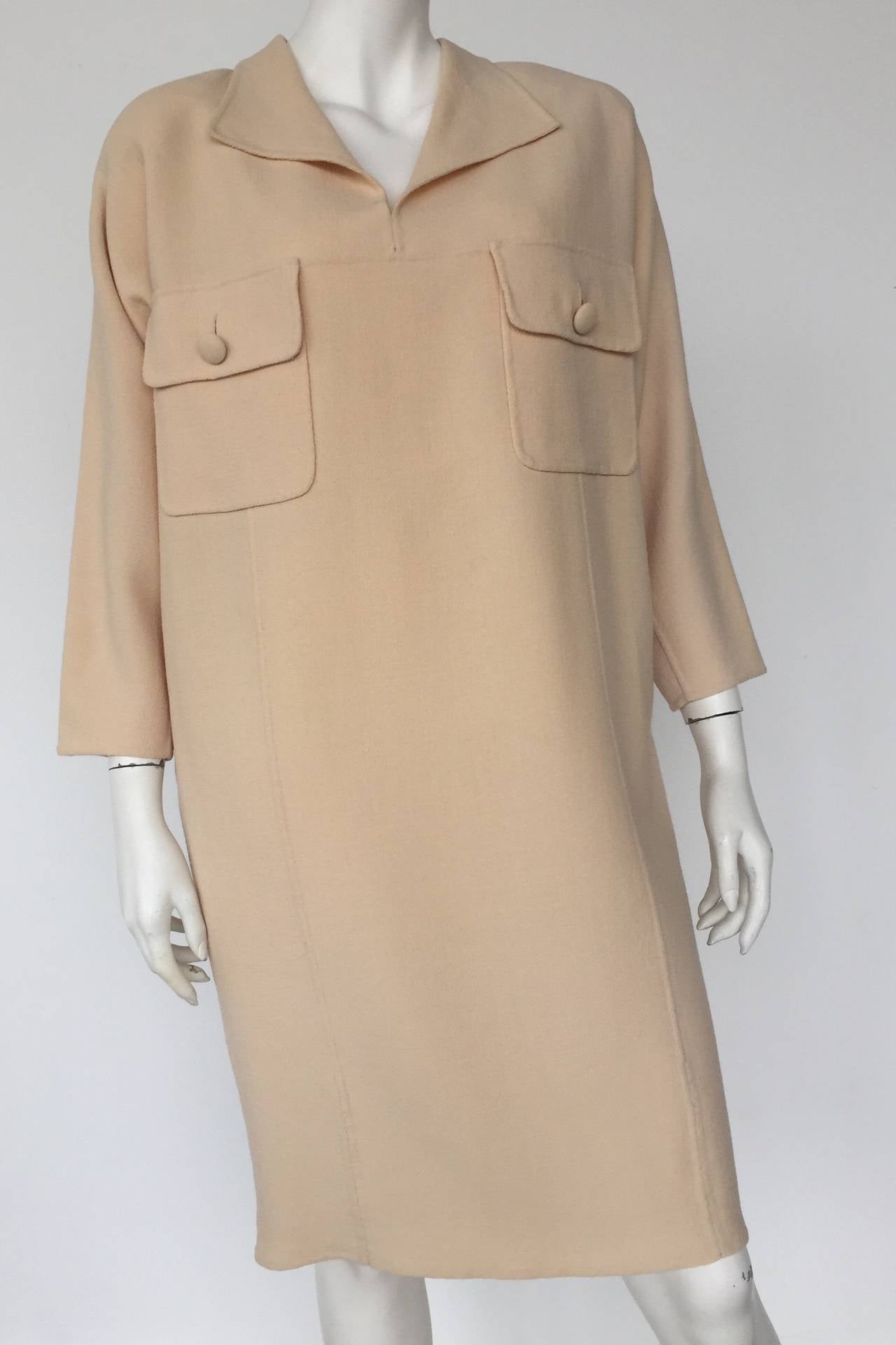 Carolyne Roehm for Neiman Marcus 1980s wool dress size 12 with pockets made in USA.  This timeless Roehm dress will provide any woman with style & sophistication for any occasion. Wear your Tom Ford heels with this piece and go turn some