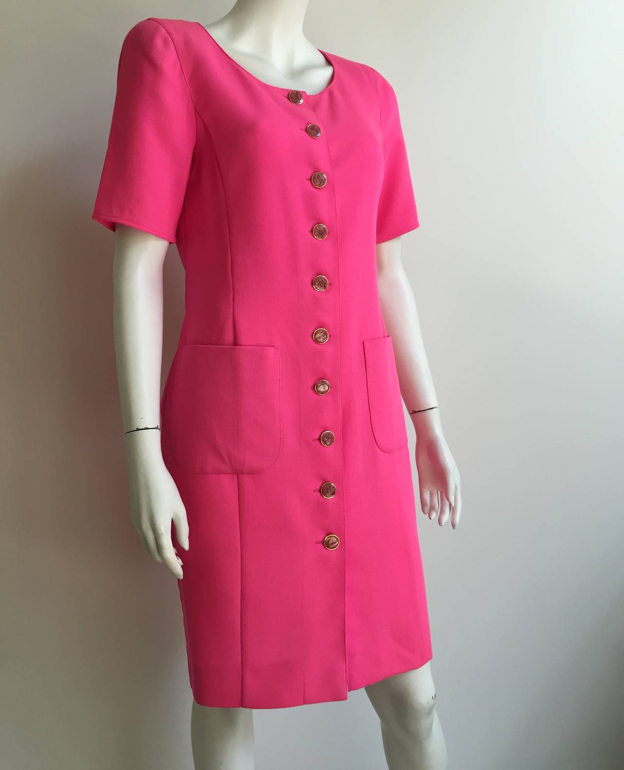 Ungaro solo donna 1980s pink wool button up dress with 2 front pockets made in Italy and size 8 / 40 ( please see and use measurements). 
Measurements are:
35" bust
31" waist
36" hips
10.5" sleeve length
39" dress