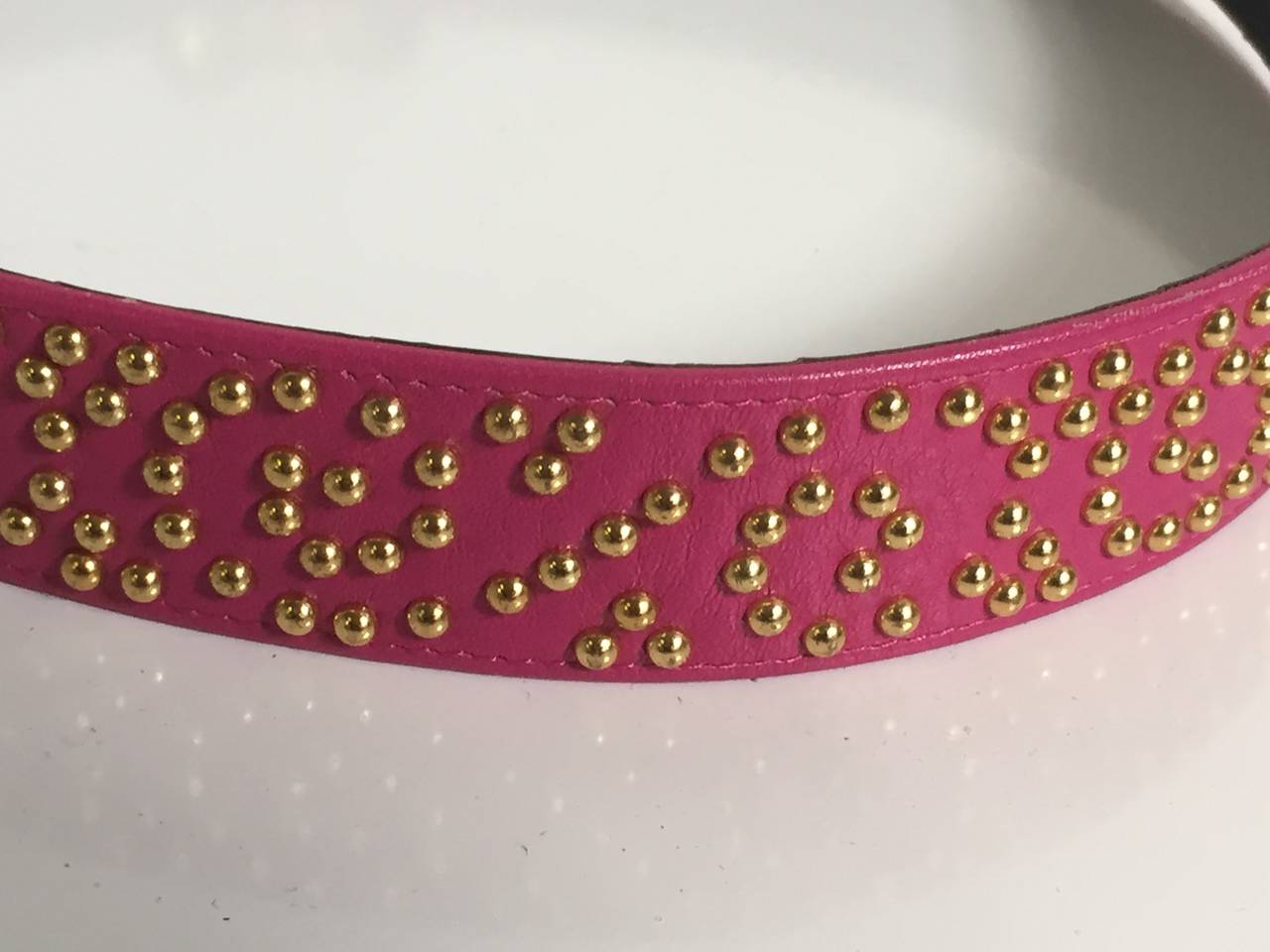 pink and black studded belt