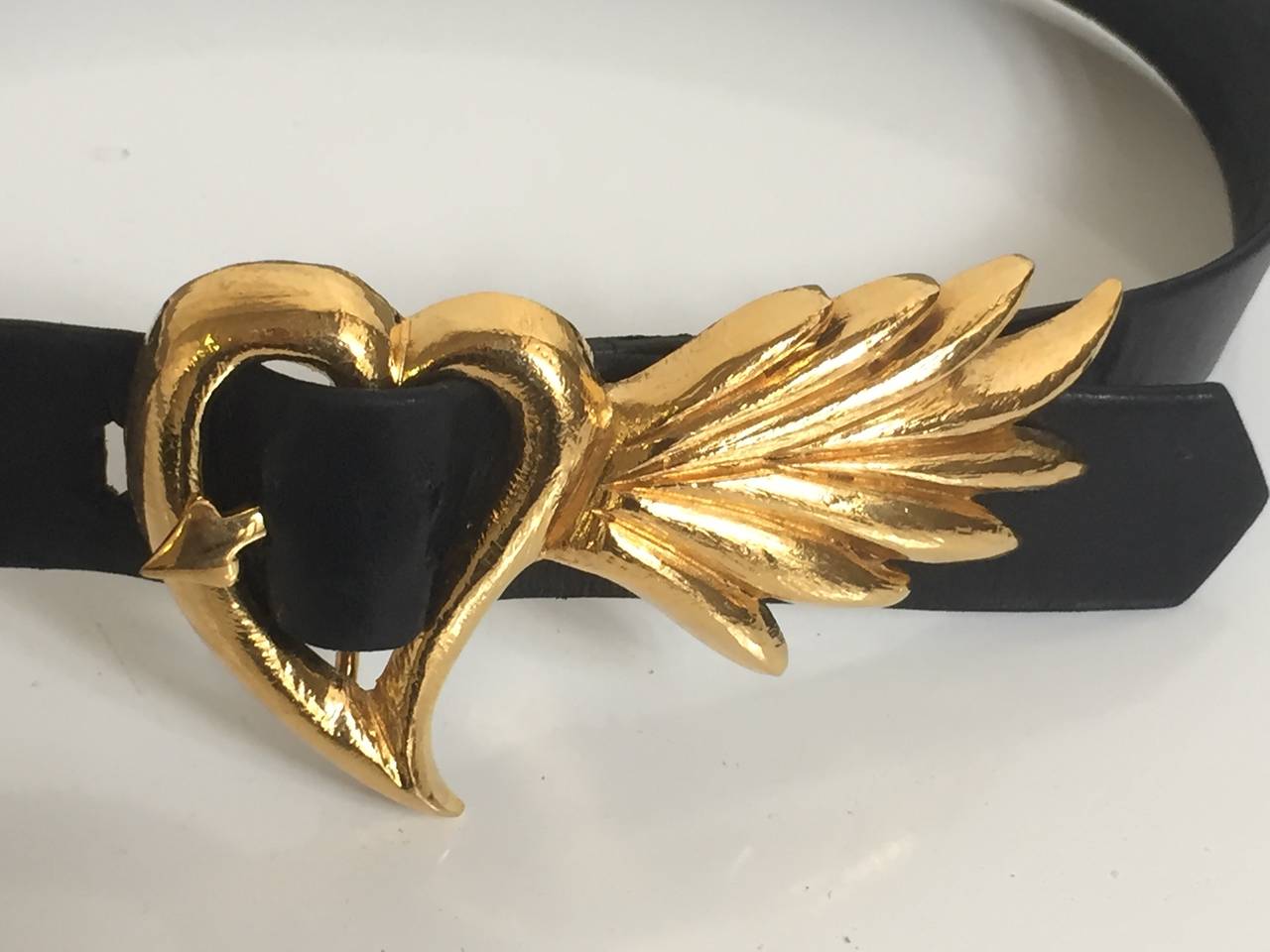 Karl Lagerfeld 1980s gold flaming heart black leather belt size small and made in France. The belt is 33
