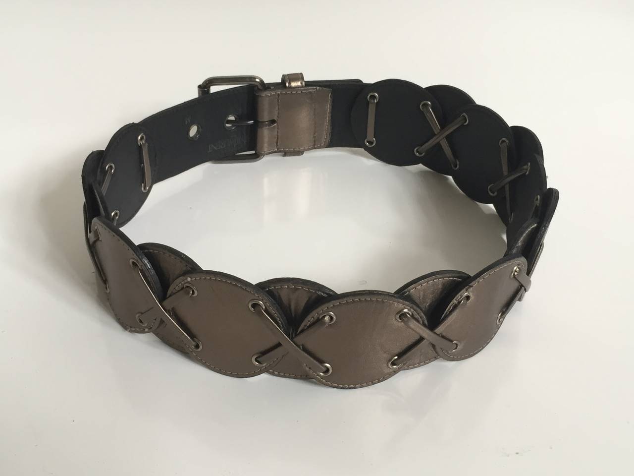 Yves Saint Laurent 1980s metallic leather belt made in France and size small.
Belt is 33