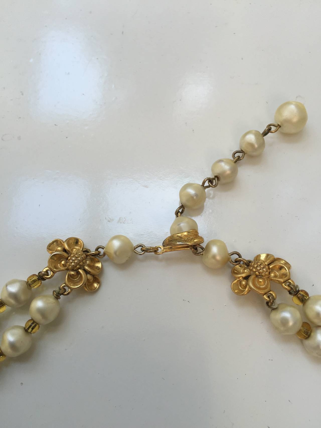 Contemporary Schiaparelli 60s faux pearl double strand necklace.