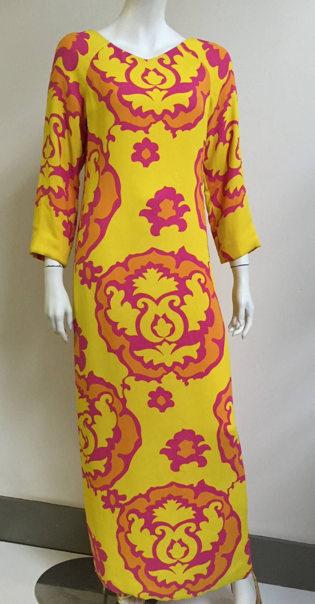 Richard Tam 1970s silk vidid colors and pattern with v neck dress fits size 8 but please see & use measurements. The exterior fabric is thick silk and interior is lined in silk as well. 
Richard Tam was only in business for seven years. His