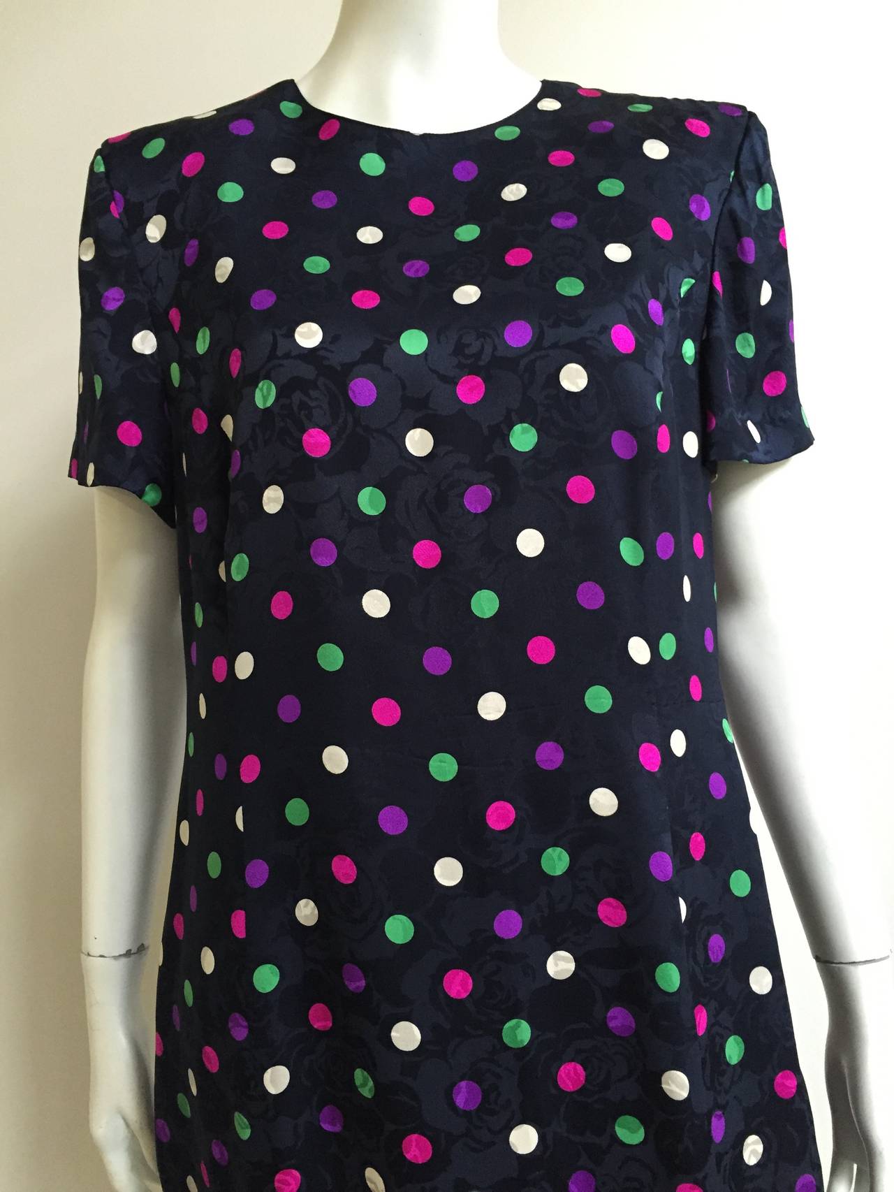 Louis Feraud 1980s silk navy with purple ~ pink ~ white ~ mint polka dots with ruffles at bottom. Dress is lined. Original size 12 but fits more like a modern size 10 ( Please see & use measurements ).
Measurements are:
41" bust
36"