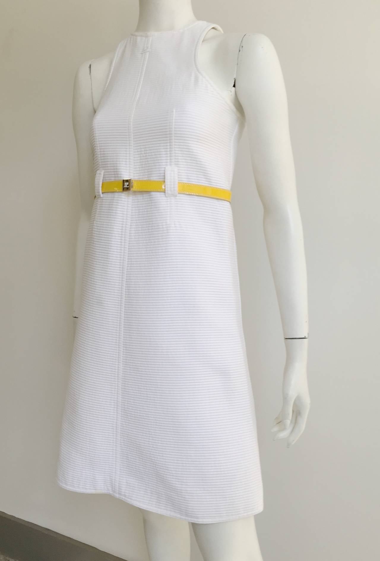 Courreges 1980s ribbed white cotton dress with yellow belt made in France size 6. Ladies please grab your tape measure so you can measure your bust, waist & hips to make certain this gorgeous gem will fit your lovely body. This is the perfect spring