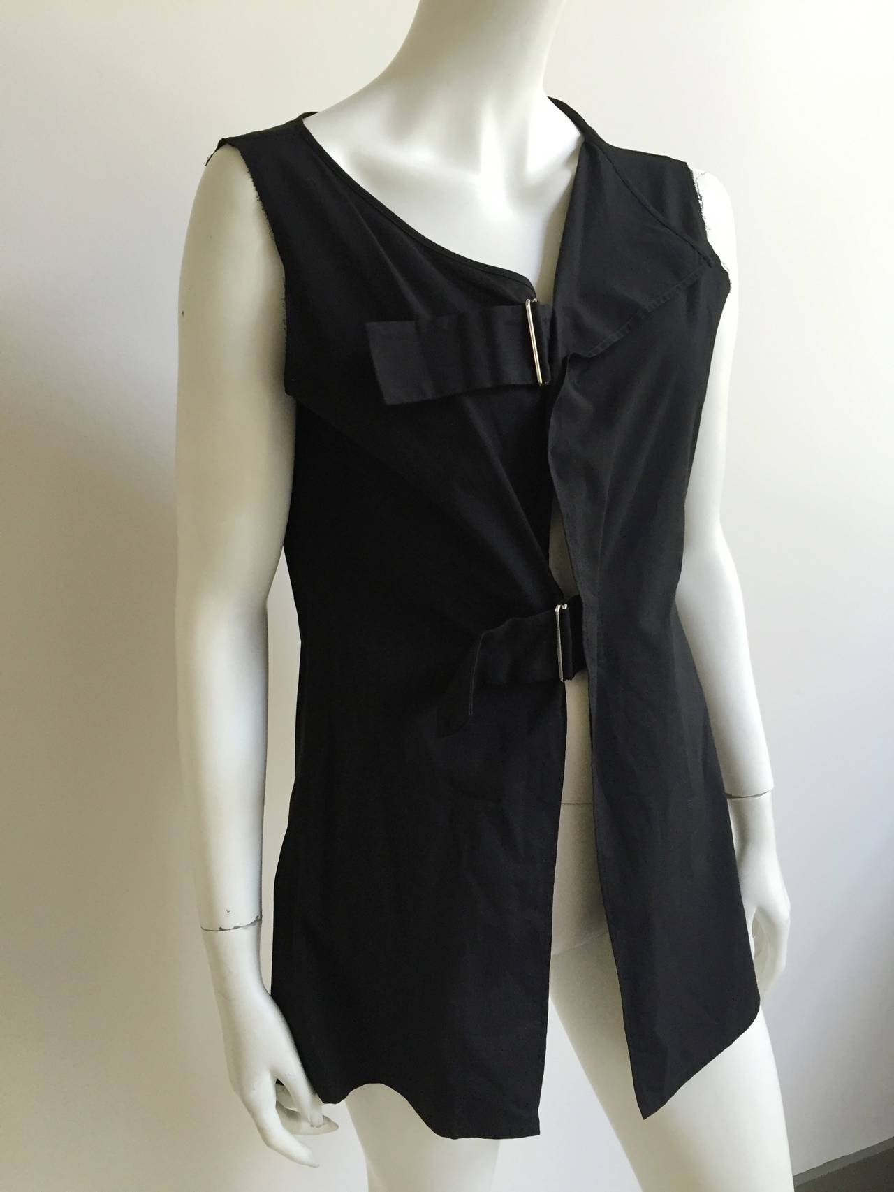 Yohji Yamamoto black cotton tunic was purchased in London at Harvey Nichols early 2000s. This sleeveless tunic with 2 adjustable buckles on front adjust to your body and is a size 2 but fits my size 4 mannequin to perfection.
Measurements are:
35
