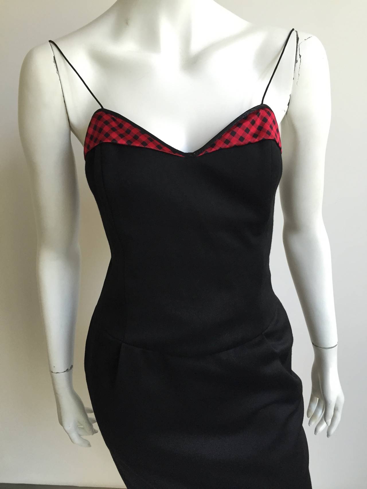 Geoffrey Beene Mr. Beene 1990s black cocktail dress with pockets & plaid trim size 4. This is your gorgeous LBD perfect for any occasion and the plaid top trim gives it that extra punch. No one could ever accuse the lady who wears this dress of