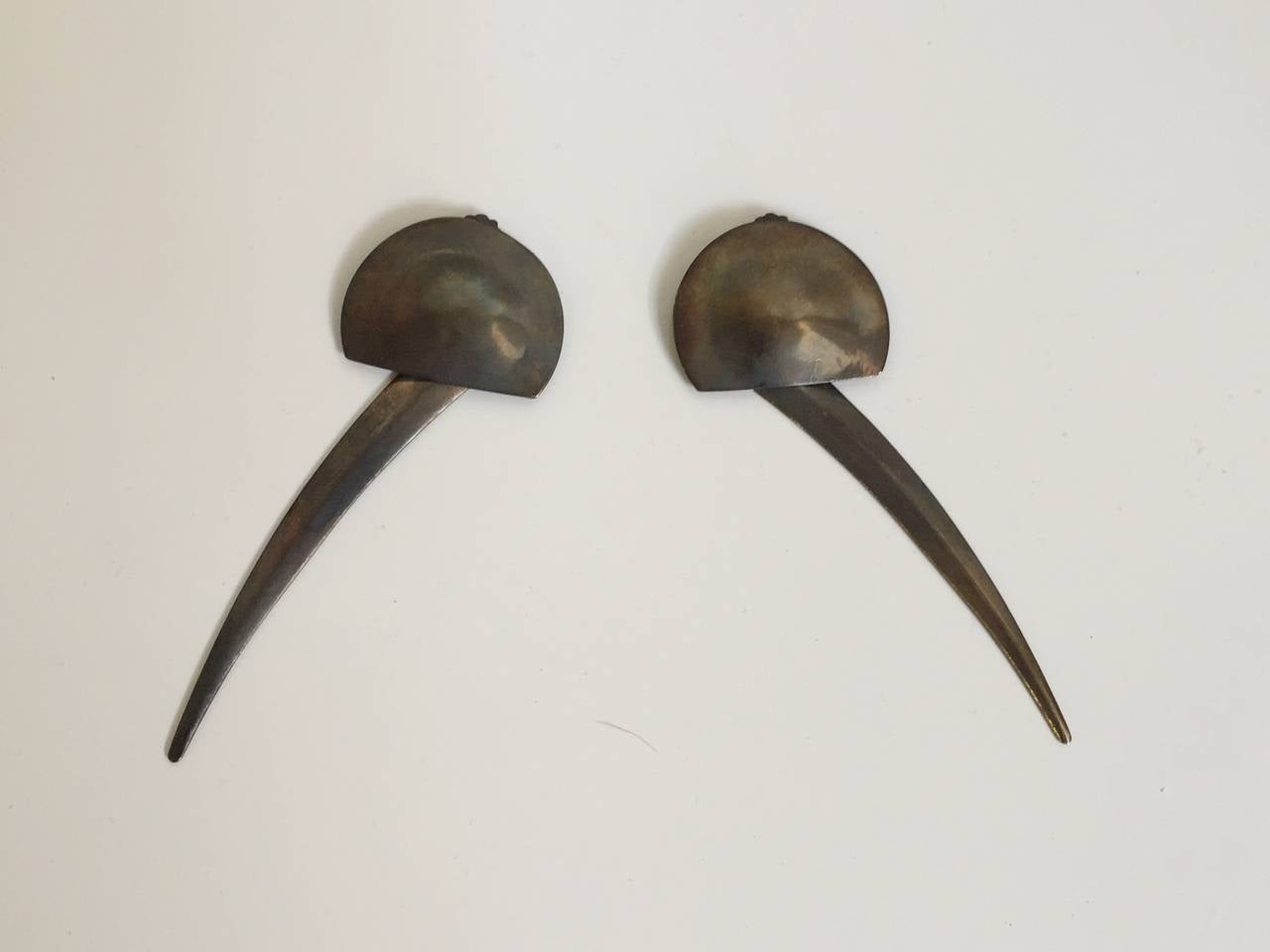 Patrick Kelly Paris 1987 sting ray design silver clip on earrings that the tail part swings!  There earrings are from the private collection of Carol Martin who was a long time friend & model to Patrick Kelly. Carol Martin wore these earrings at a