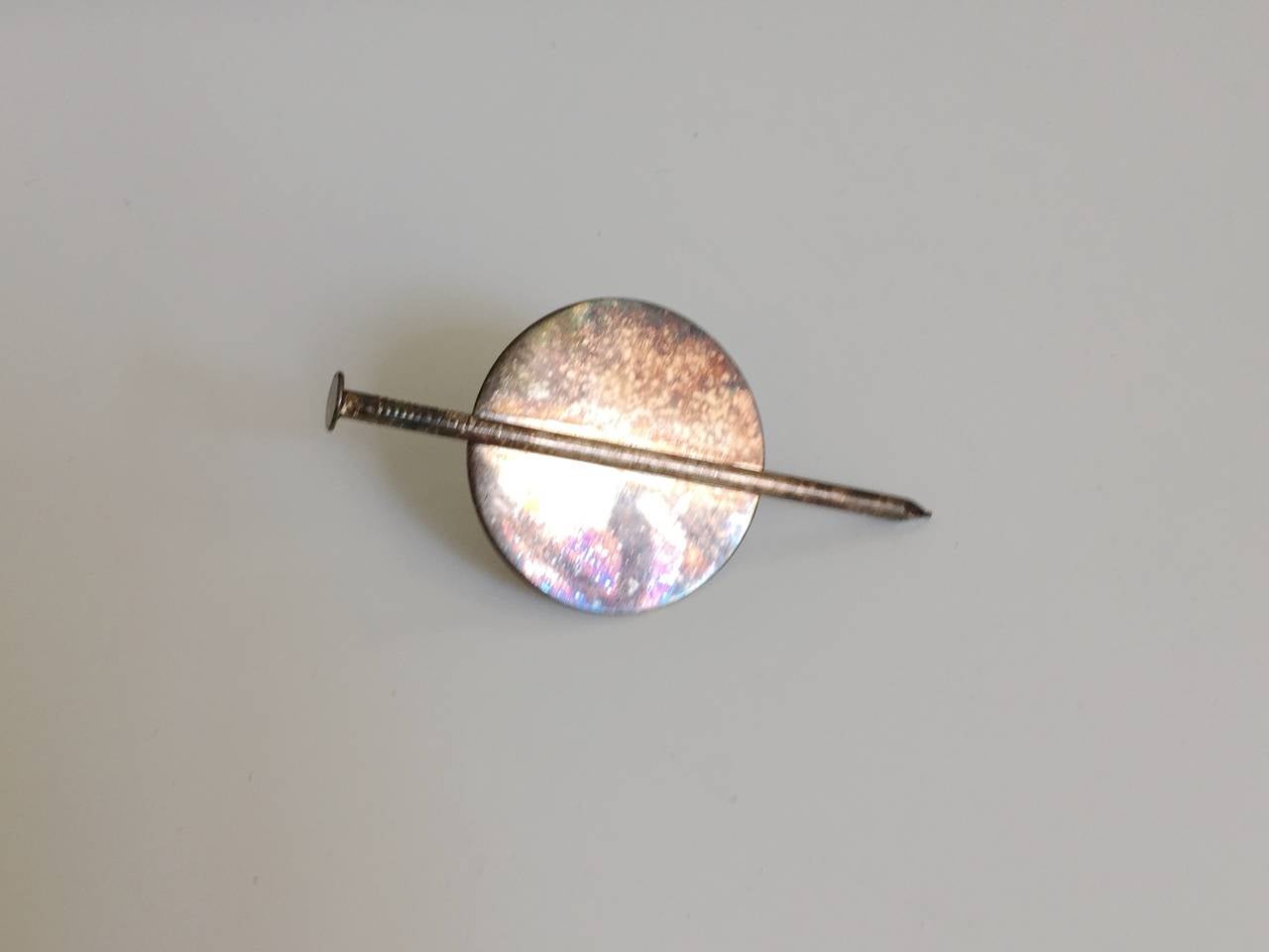 Patrick Kelly Paris 1988 silver nail clip on earring from the private collection of long time friend & model Carol Martin of Atlanta. This is from Patrick Kelly's 1988 fall / winter show where he designed many fabulous pieces using the 'nail'