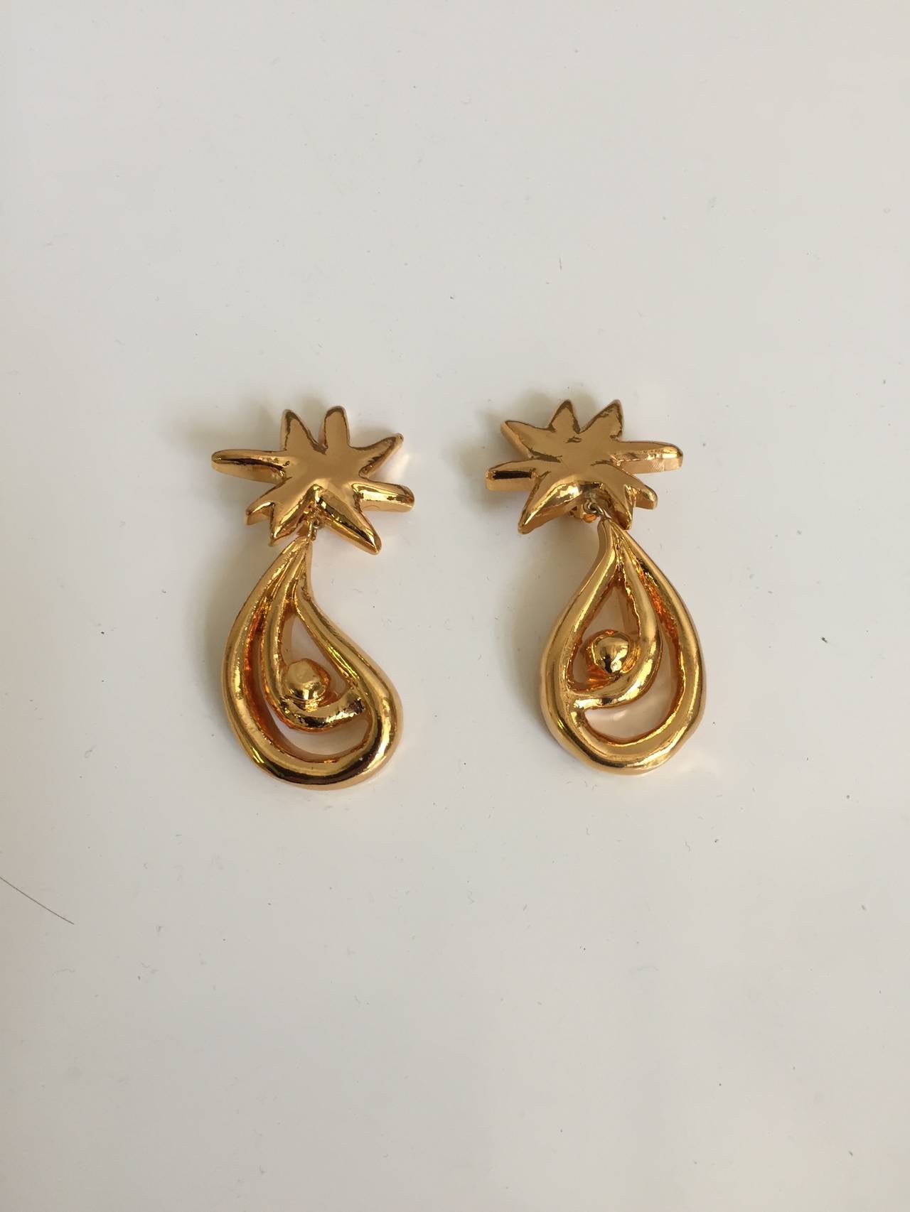 Christian Lacroix 1980s light weight gold whimsical drop clip on earrings. 
Made in France. 
Measurement is 3.5" long.