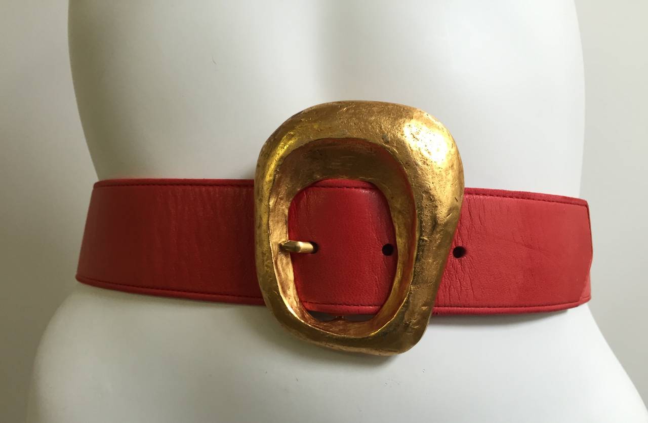 Christian Lacroix 1980s coral leather belt with abstract gold buckle. Made in France and is a size 40 but fits like a size 4 / 6 ( Please see & use measurements to measure your waistline). 
Measurements are:
32.5" belt long
1.75"