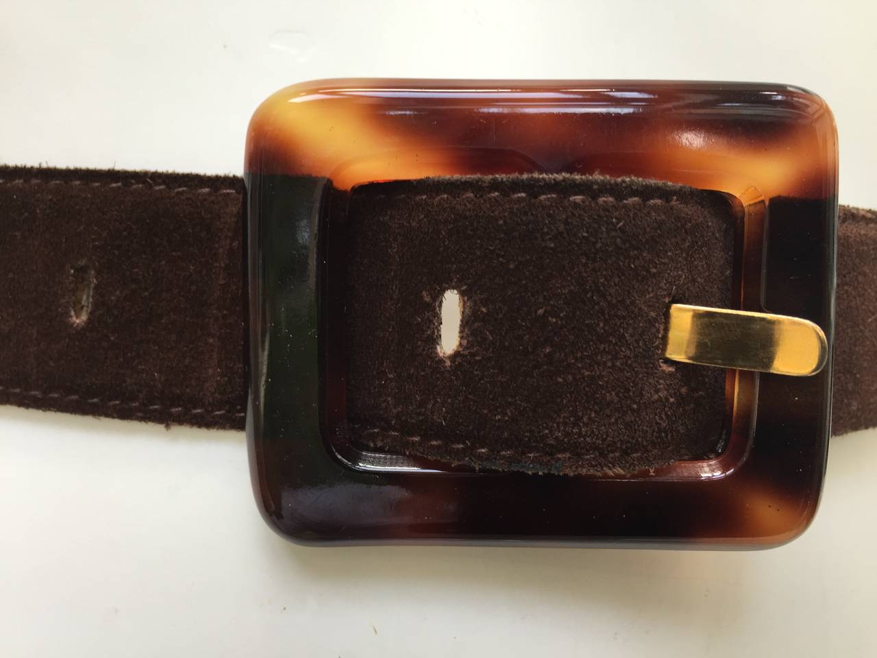 Yves Saint Laurent 1980s brown suede tortoiseshell buckle belt size medium but please see measurement.  This belt will fit anyone size 2 - 4 . 
33