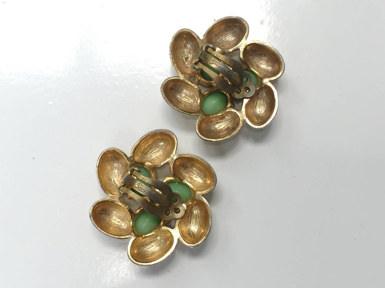 Elsa Schiaparelli 60s gold clip earrings. For Sale 1