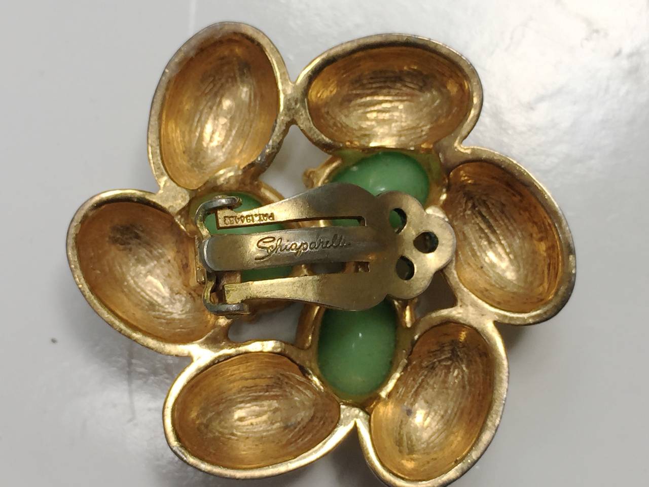 Elsa Schiaparelli 60s gold clip earrings. For Sale 3