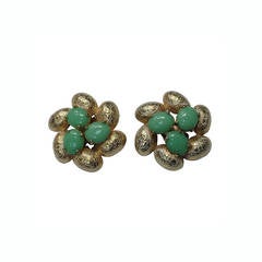 Elsa Schiaparelli 60s gold clip earrings.