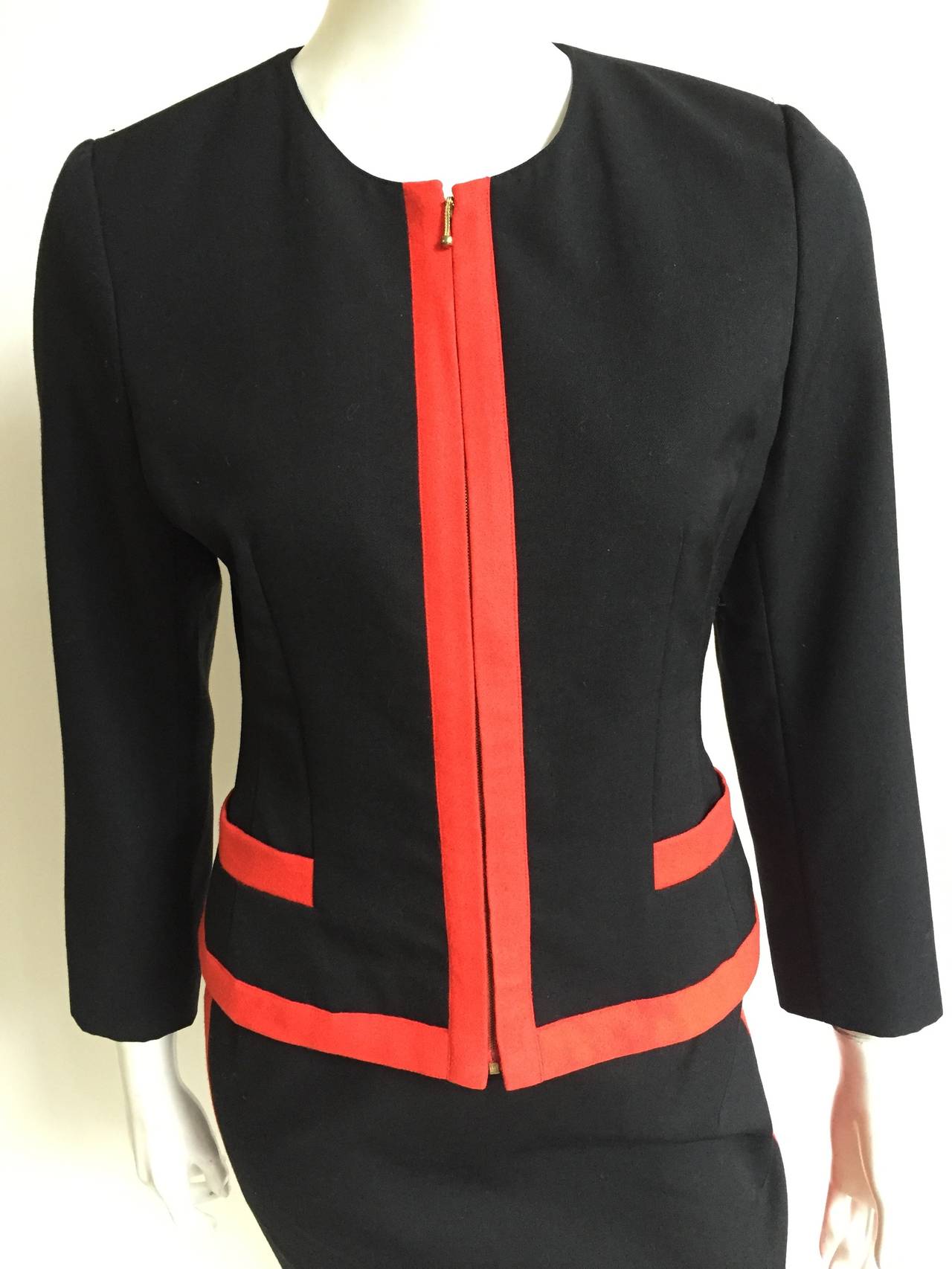 Lolita Lempicka Paris 1980's black with red trim wool skirt suit is a 38 but fits like a  size 4 ( Please see & use measurements). Zipper jacket with two front pockets. Gorgeous & timeless skirt suit perfect for a drink at the Four Seasons