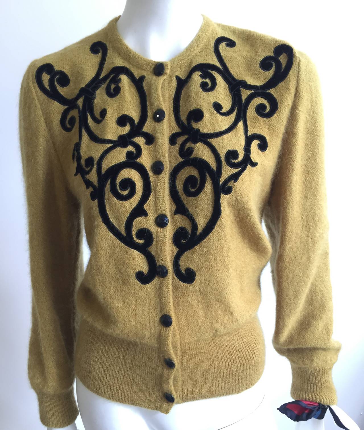 Gucci 1981 mohair & wool button up cardigan sweater with velvet appliqué size medium. This was purchased at the original Gucci store in Florence Italy in 1981. There are 2 extra black buttons inside sweater.  This vintage classic Gucci cardigan