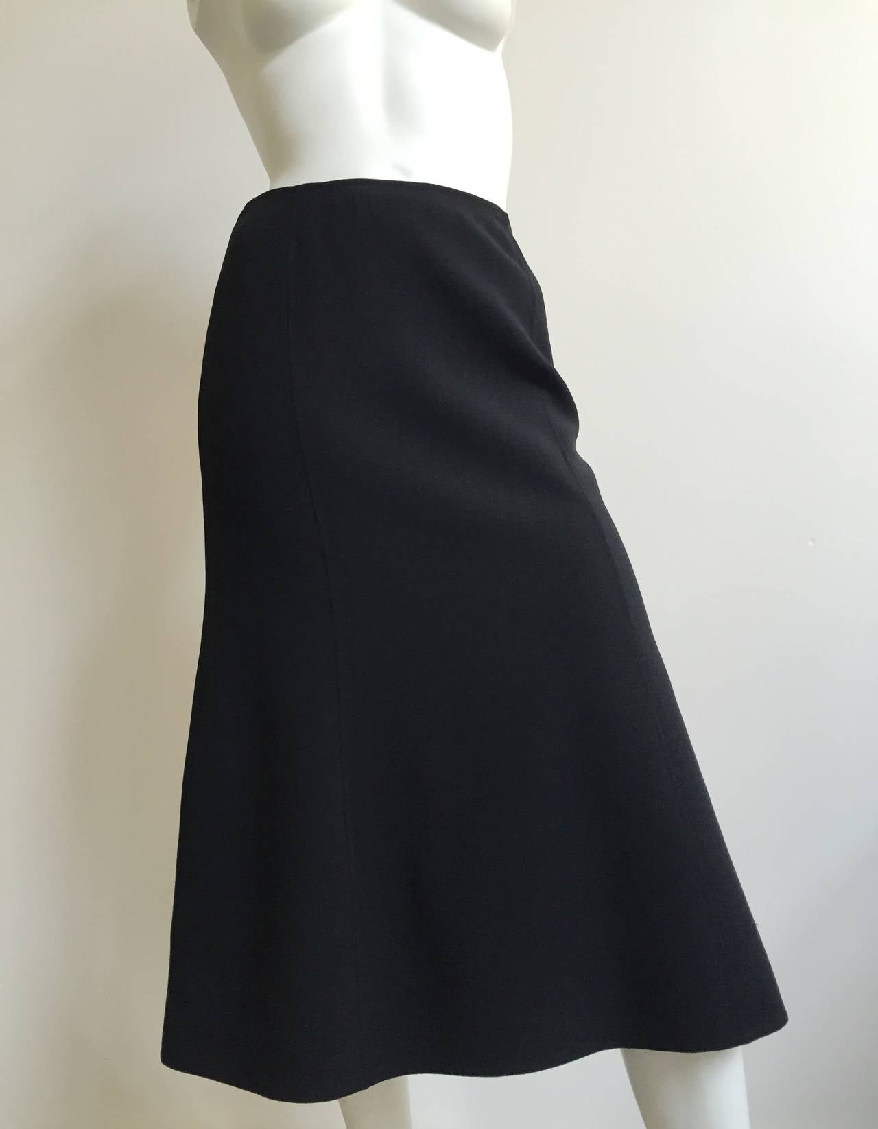 Celine black wool skirt hand finished for that quality touch is a French size 38 but fits like a 4/6 ( Please see & use measurements so that you can properly measure your body). High waisted skirt.
Measurements are:
27.5
