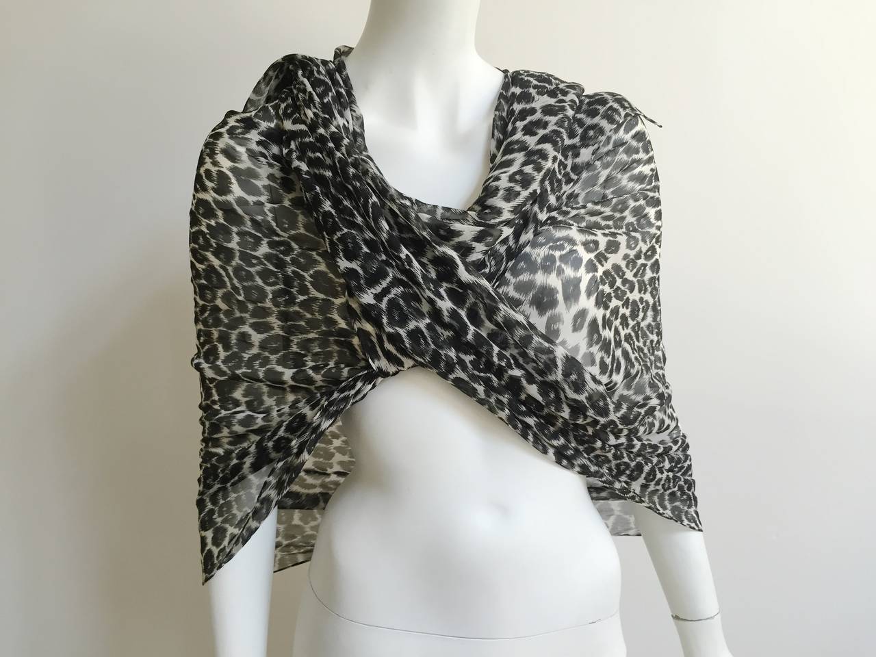 Yves Saint Laurent long silk cheetah print scarf. This was purchased at Neiman Marcus in Atlanta. 
Measurements are:
92