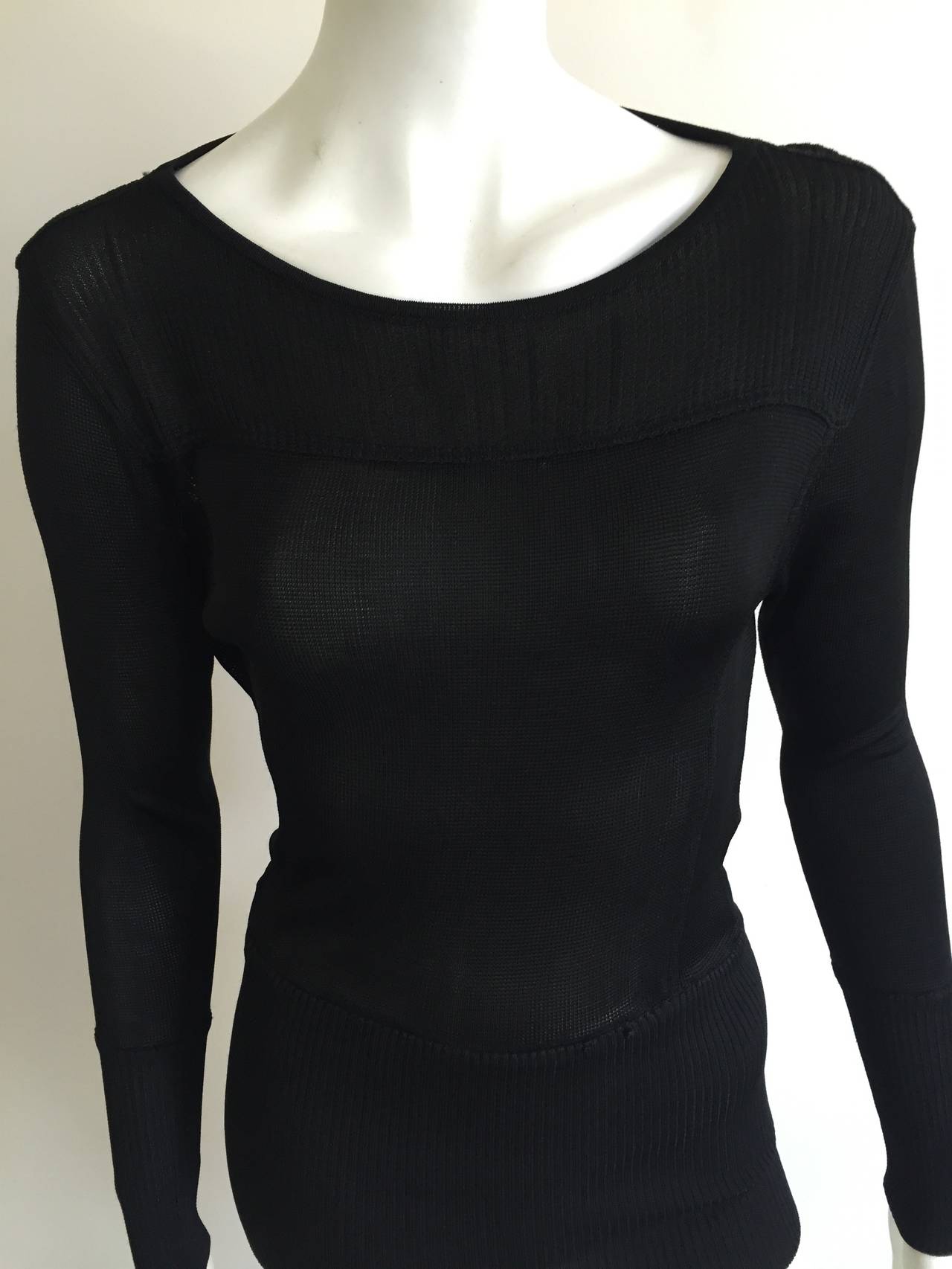 Claude Montana Knitwear 1980s black top will fit a size 4 / 6 ( Please see & use measurements to properly measure your body). This piece was purchased from a high end Atlanta store and never wore the piece. The sheer fabric and cut out back make