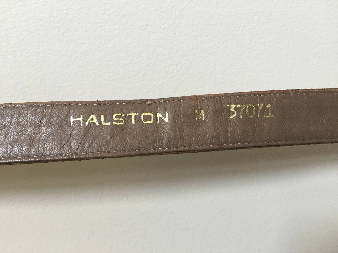 Halston 70s tan snake skin belt size small. 1