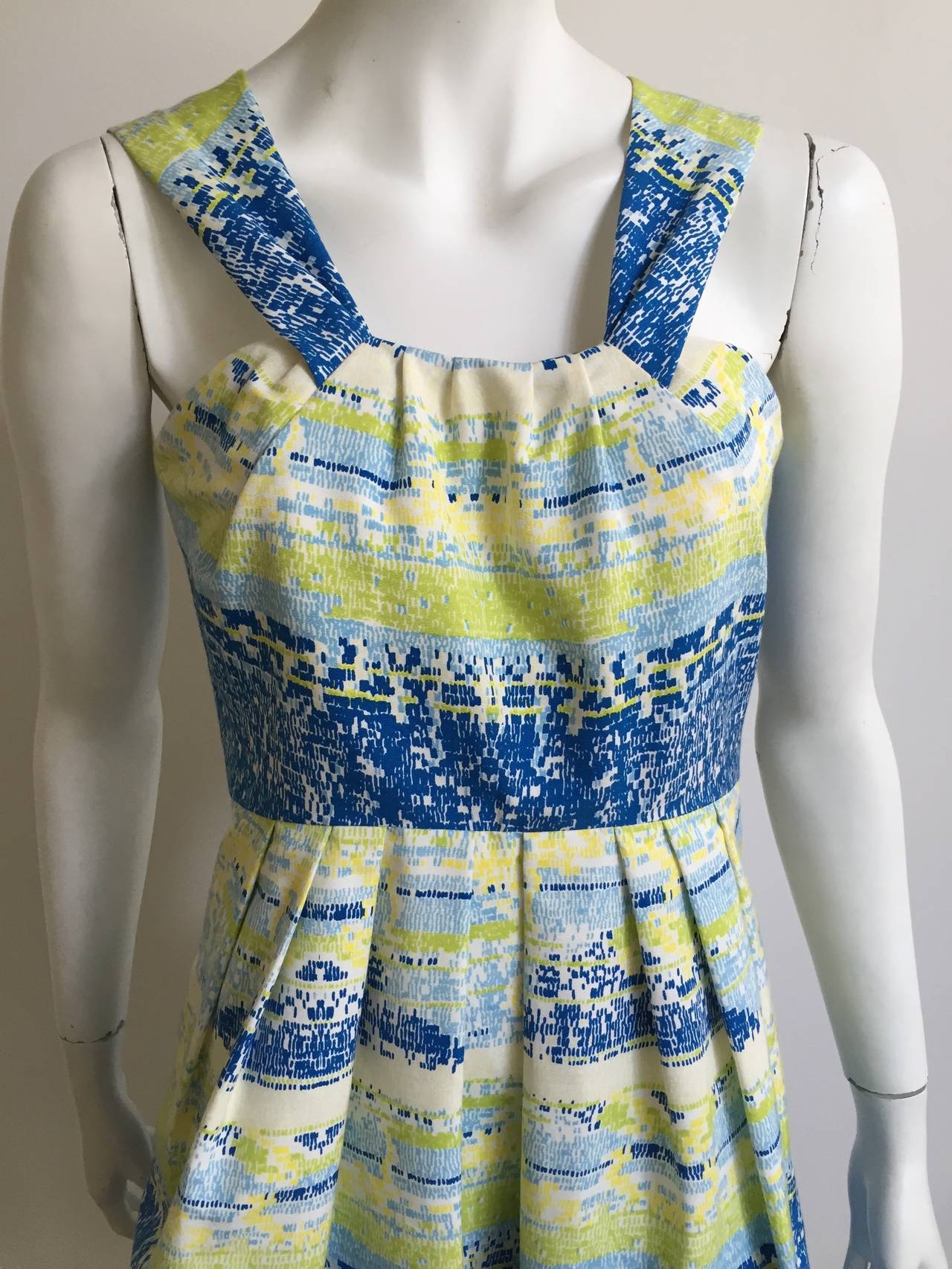 Bill Blass by Peter Som 2009 cotton dress with pockets is a size USA 4.  Please see & use measurements provided to make sure it will fit you to perfection. Boned corset bodice with addition interior zipper for added support, see photo. Dress is