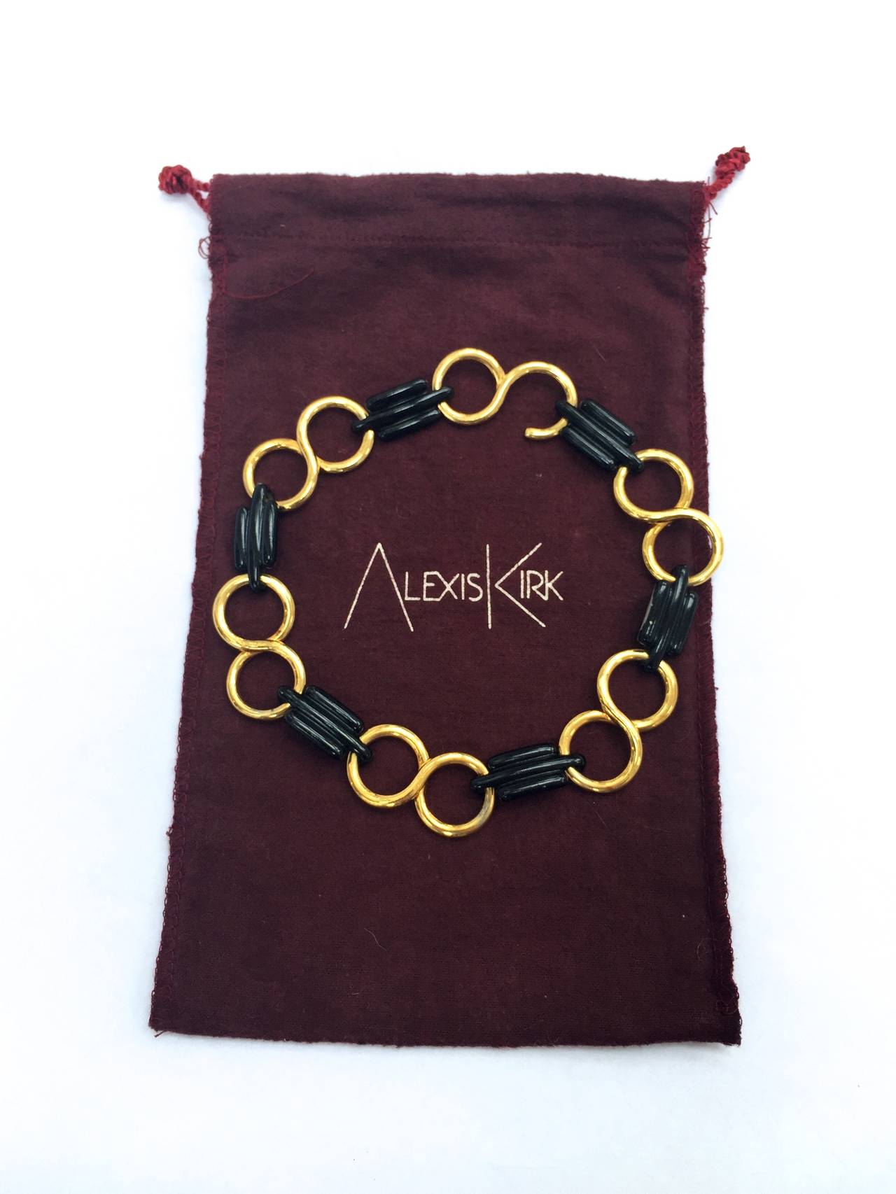 Alexis Kirk 1980s infinity brass links with black metal Art Deco links necklace. This necklace was given to my client by Ed Riley who worked for Alexis Kirk. Ed Riley worked for Alexis Kirk and then worked for Halston.
This gorgeous Alexis Kirk