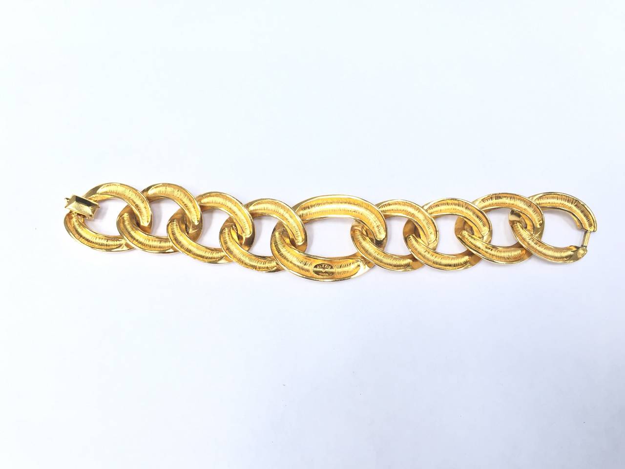 Modern Alexis Kirk 80s gold chain link bracelet.