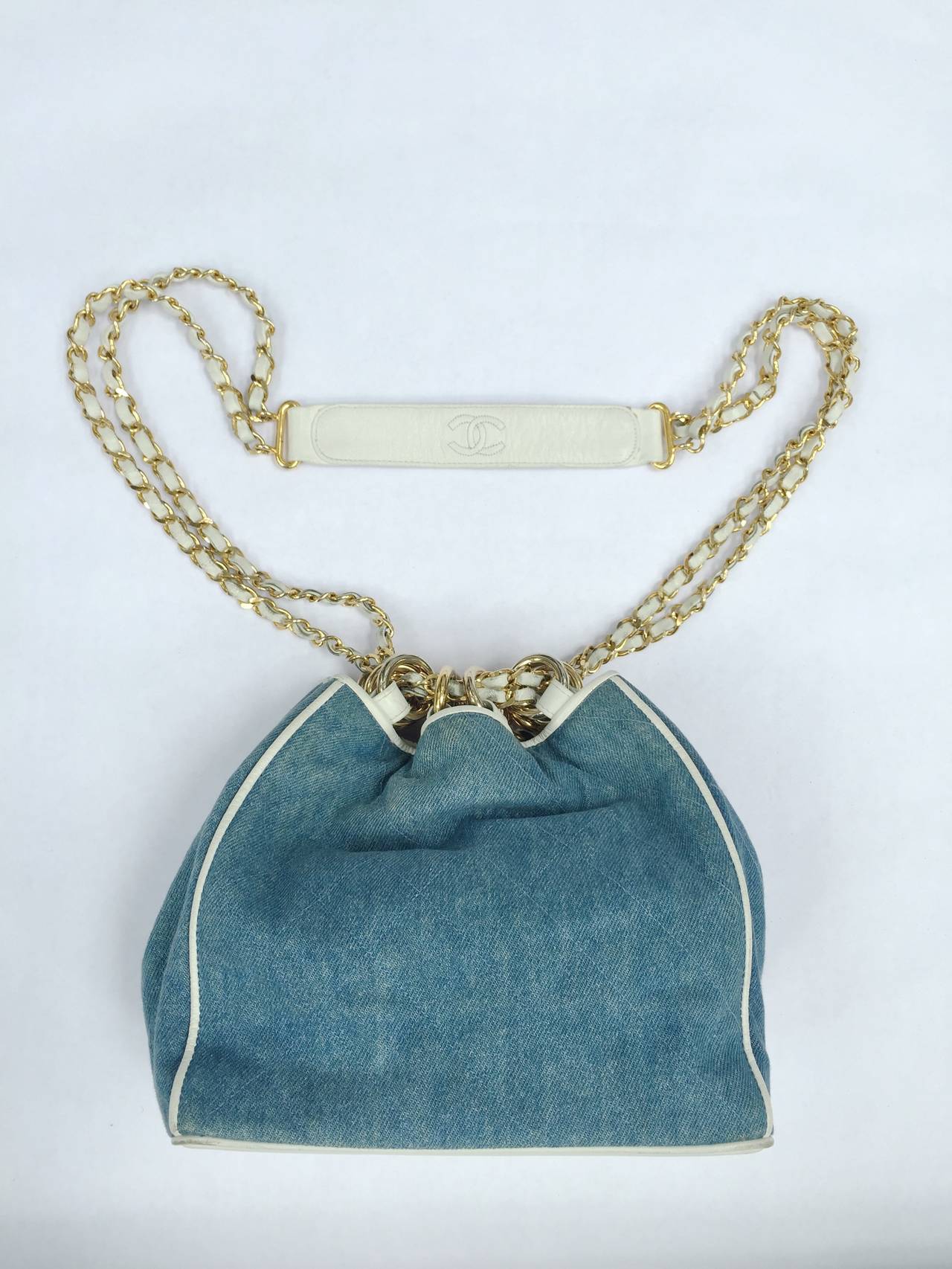 Blue Chanel denim white leather trim shoulder handbag.