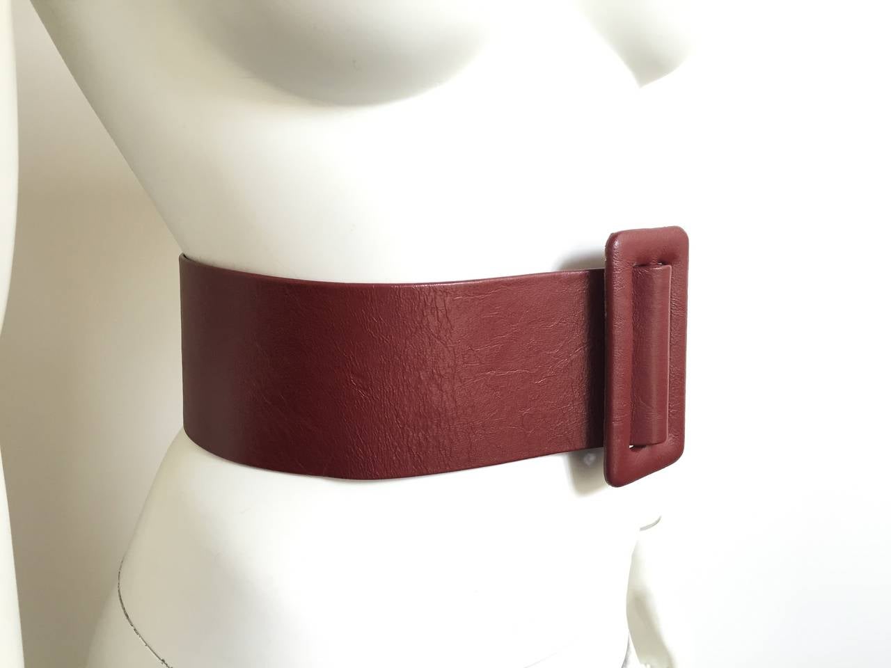 Geoffrey Beene 1980s Autumn rust color wide leather belt is a vintage size 8 but fits a 4 / 6 .
33. 1/2