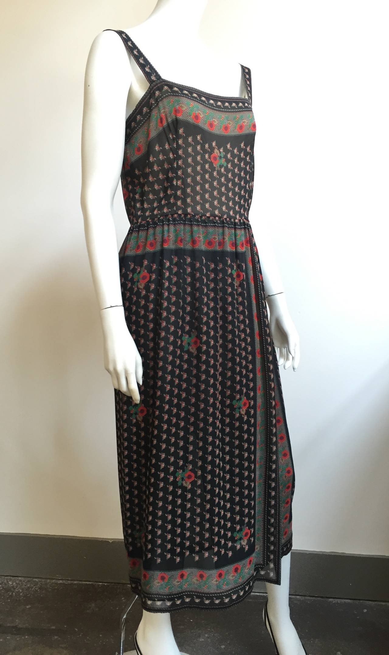 Pauline Trigere for Neiman Marcus 1980s silk peasant dress is a size 8.  Please see & use measurements to properly measure your lovely body. Dress is lined. 
Measurements are:
40