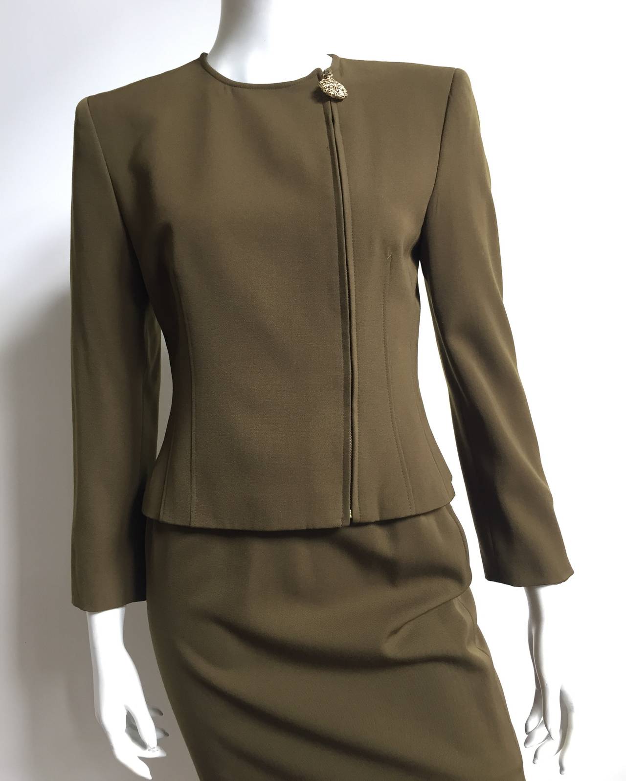 Genny by Versace 1980s olive green wool 2 piece skirt suit is a vintage size 6 but fits like a modern USA size 4.  Please see & use measurements so this vintage treasure will fit you the way Gianni would be proud. Gorgeous modern design zipper