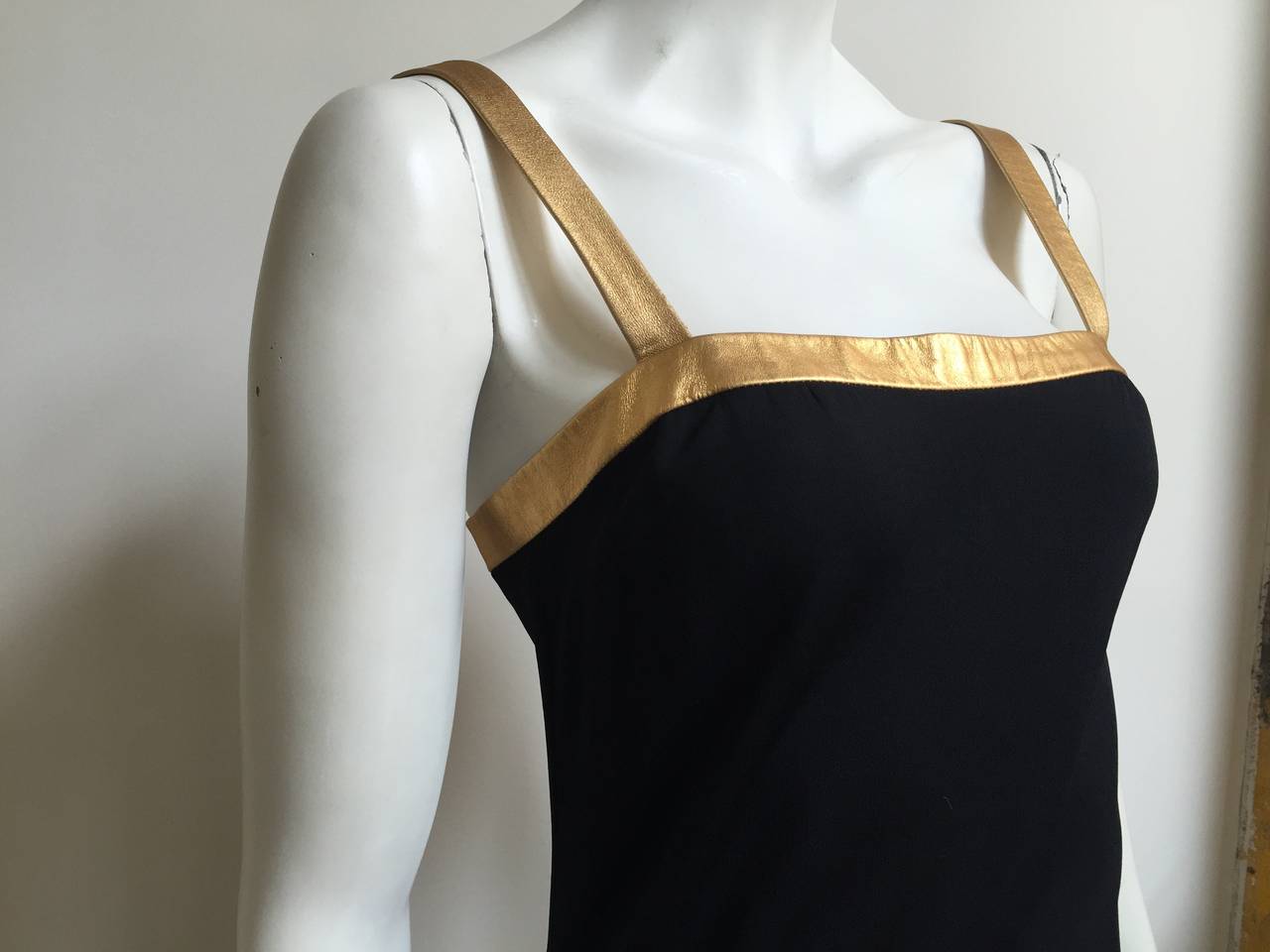 Ralph Lauren Collection Purple Label long black jersey with gold leather straps and trim will fit a size 6.  Please see & use measurements below so you can properly measure your body. This stunning RL gown with gold leather trim & straps is