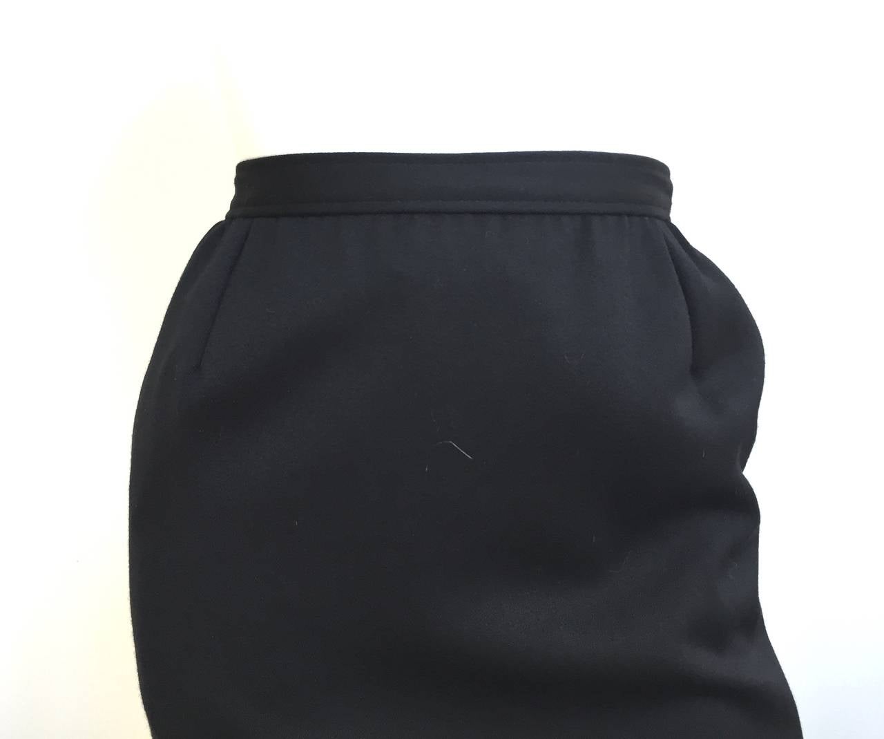 Valentino Miss V 1980s black wool wrap skirt is a vintage Italian size 44 but fits like a modern USA size 4.  Please see & use measurements below so that you can properly measure your lovely body so that Valentino would be proud. 
Velvet trim along