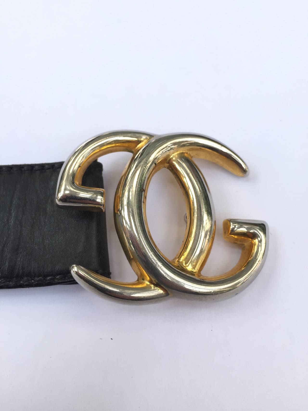 Gucci 'GG' logo buckle on black leather strap belt. at 1stDibs