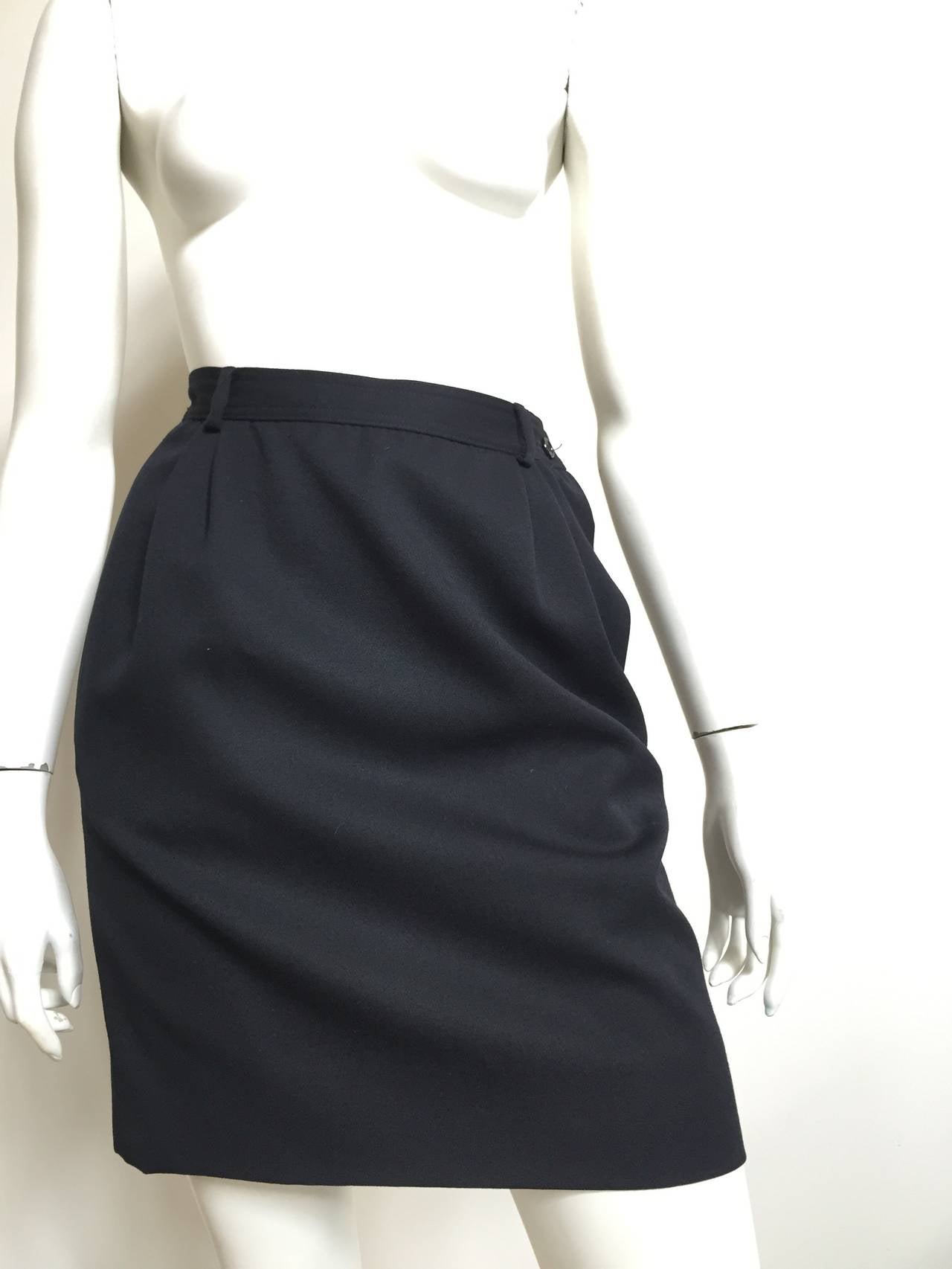 Valentino V Studio 1980s black wool skirt with pockets is an Italian size 42 but fits a modern day USA size 6.  Please see & use the measurements to measure you waist & hips to make sure Valentino would be proud of you wearing this vintage treasure.