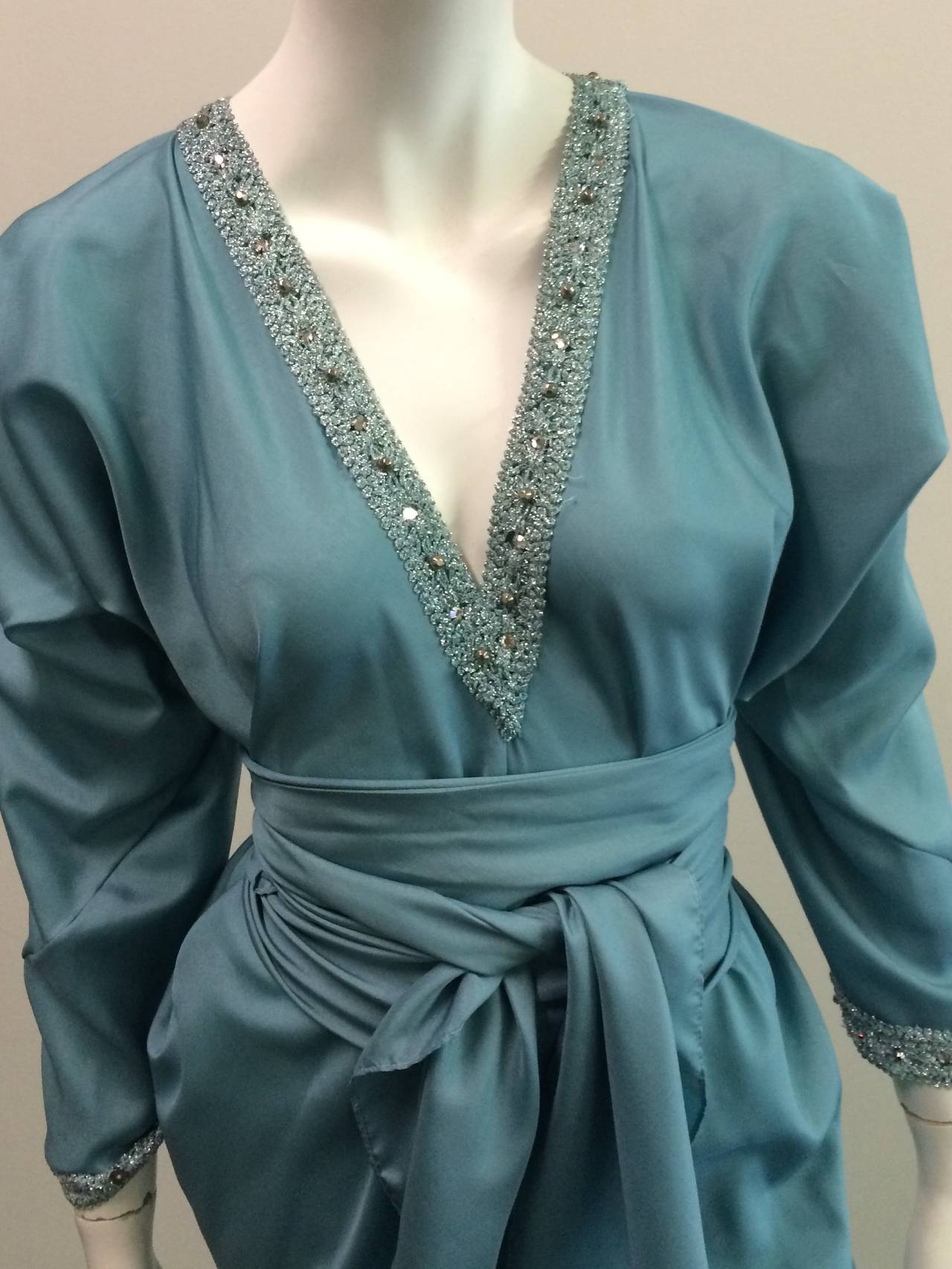 Halston 1970s caftan / gown with beading trim around collar and sleeve cuff is a one size fits all gown. Worn with our without sash for an instant photo opt.