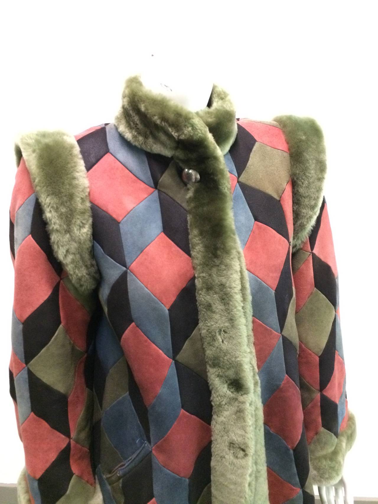 Christian Dior 70s abstract leather patchwork coat shearling faux fur trim and lining made in France. This breathtaking 70s Dior piece is a perfect example of why this couture house has stood the test of time. The abstract diamond pattern and