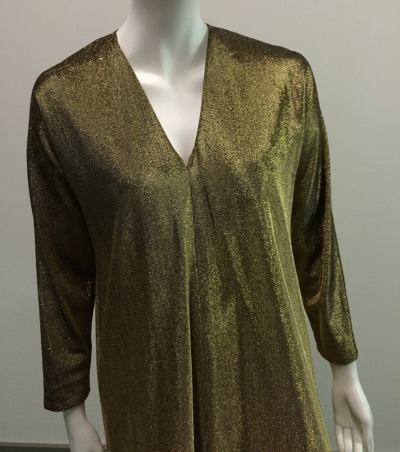 Halston IV for I.Magnin 1970s gold metallic caftan. This gold caftan is what you would have seen Elizabeth Taylor wear while partying in the south of France. It is a one size fits all but please see measurements. Besides being stunning it is a