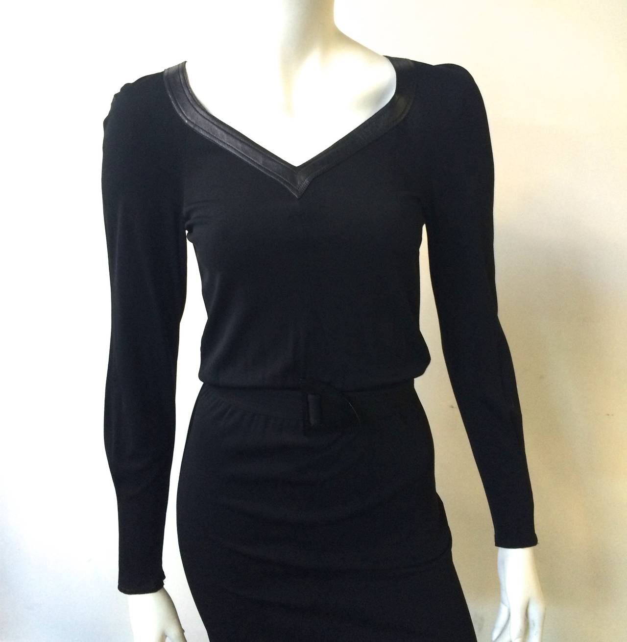 Jean Muir for Neiman Marcus 1980s LBD has an elastic waistband with the most amazing modern belt buckle on the planet will fit a size 4/6.  Ladies please grab your tape measure so you can properly measure your bust, waist & hips to make certain this