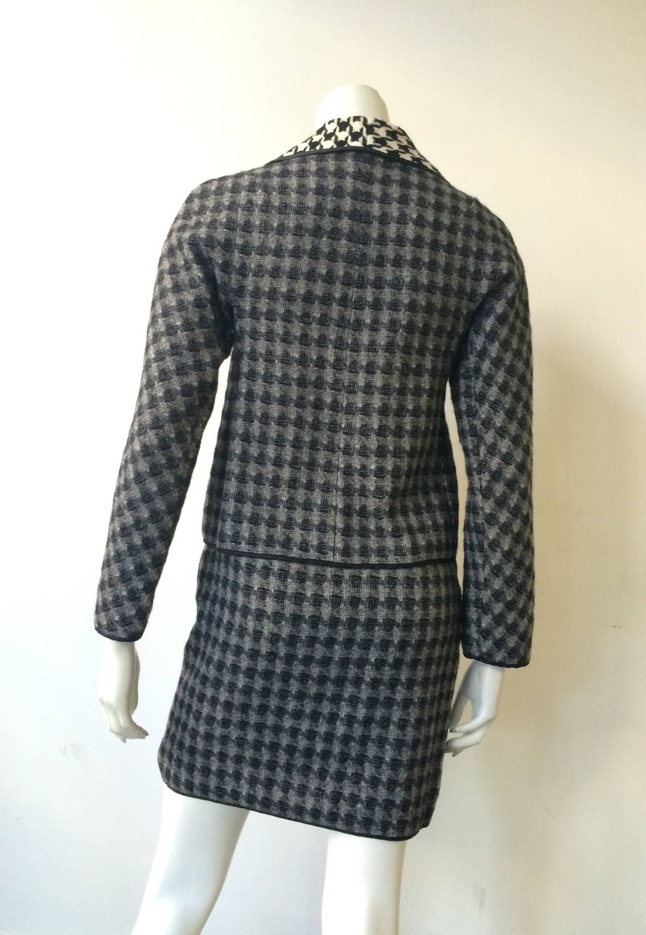 Moschino houndstooth wool jacket & skirt size 6 but see measurements. Made in Italy and named after Franco Moschino Mr Fashion Rebel himself who's wacky, imaginative designs never failed to entertain. 
Measurements for jacket :
Shoulder to