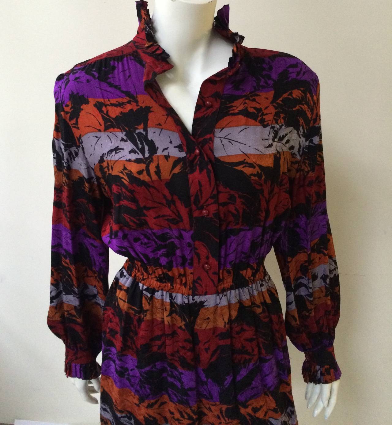 Nina Ricci Boutique Paris 70s silk dress made in France.  Abstract leaf print, ruffled collar & sleeves with elastic waistband makes this Nina Ricci a show stopper. Mild shoulder pads. Nina Ricci was born in Italy and moved to France where she