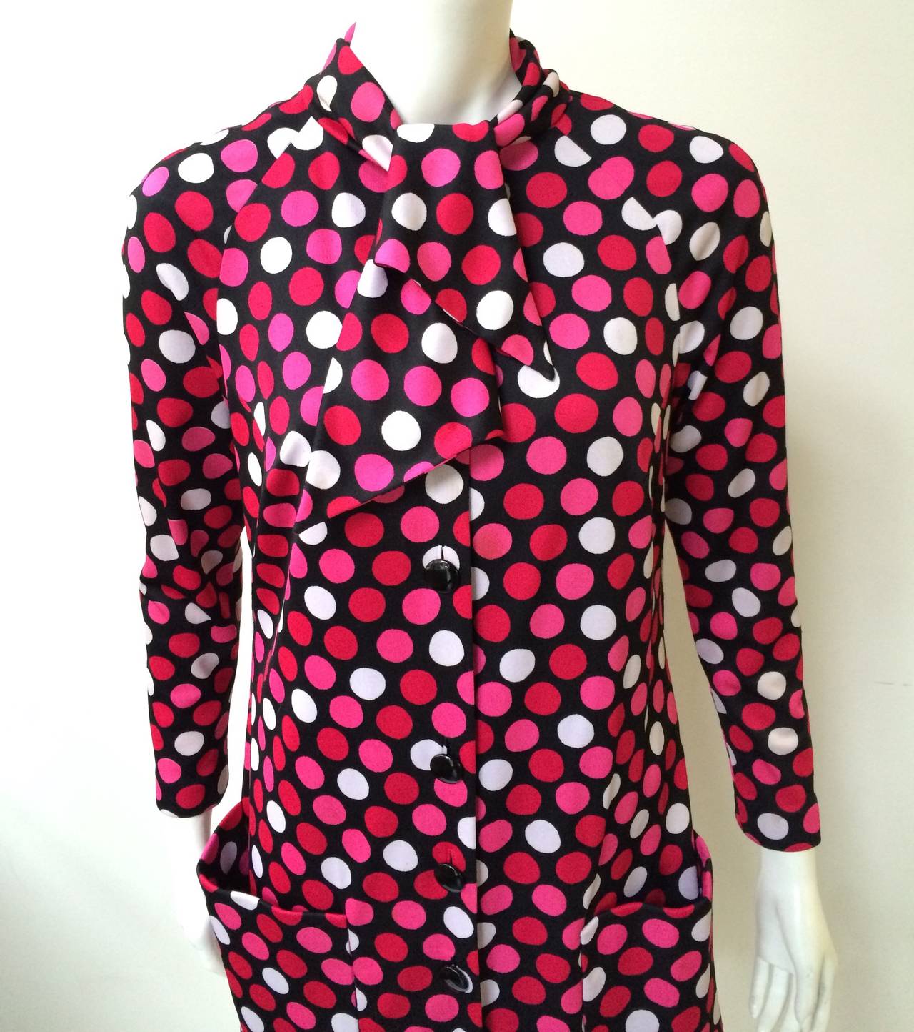 Pauline Trigere for Stanley Korshak of Chicago 80s polka dot dress with collar scarf and front pockets. Backside of dress has inverted pleat. White, pink & red dots against the black background will put a smile on your face. Has belt loops but did