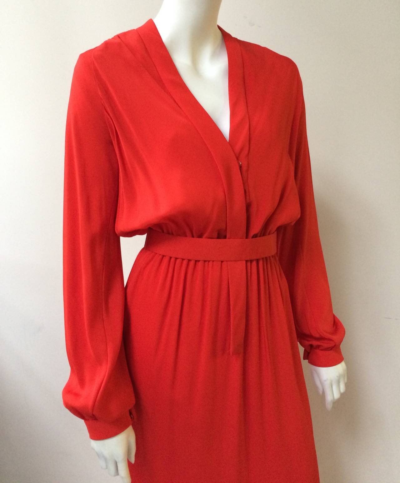 Geoffrey Beene for Beene Bazaar 1960s red plunging neckline, elastic waistband with pockets & original belt. This maxi dress does not have a fabric content label but feels like thick silk.  The mannequin is a size 4 so this dress is going to fit 4-6