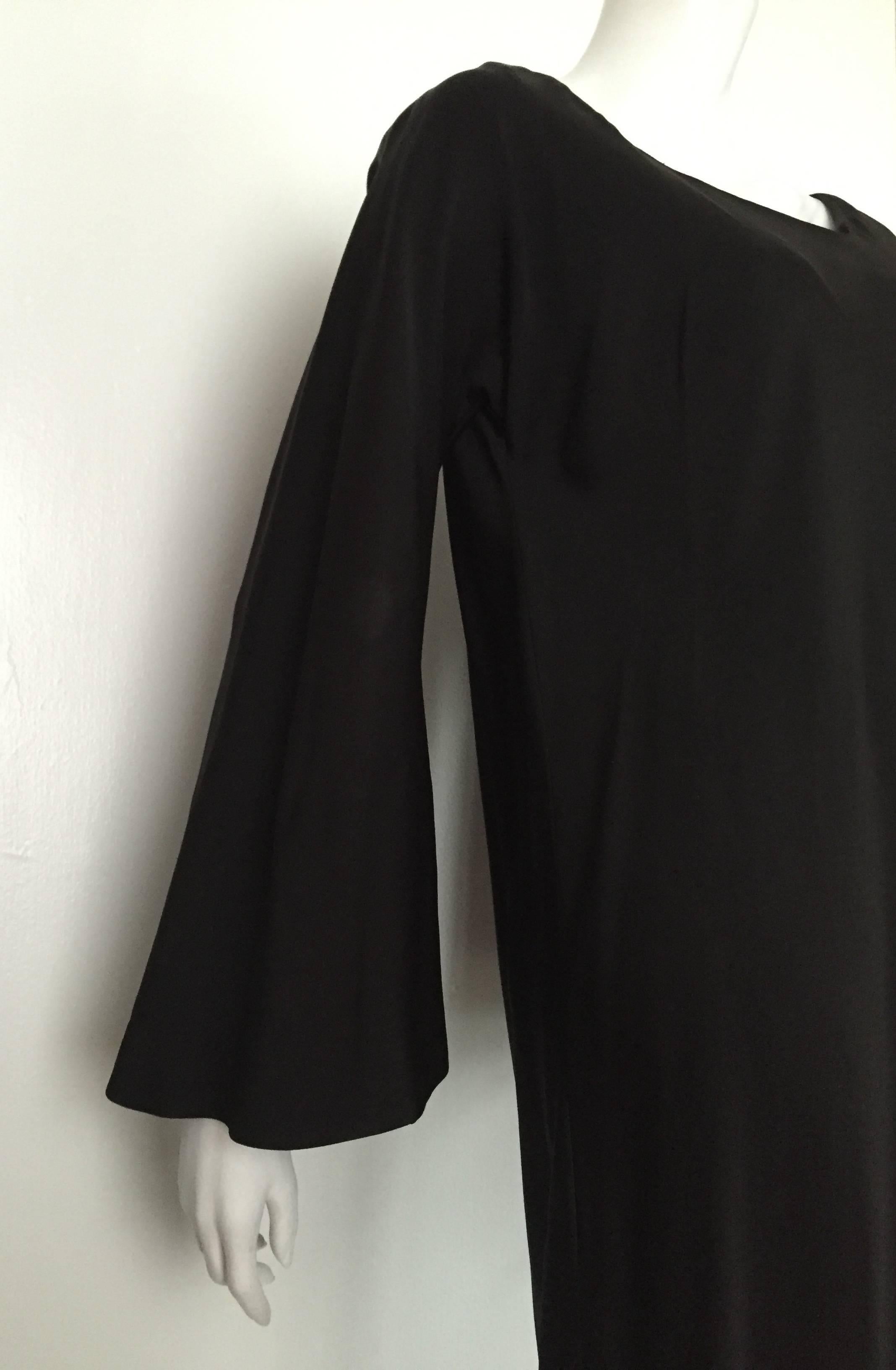 Pauline Trigere 1980s black silk evening dress with bell sleeves will fit a size 12 / 14 but please see the measurements below and properly measure your body so you will be 100% certain this vintage piece will fit you to perfection.
This treasure