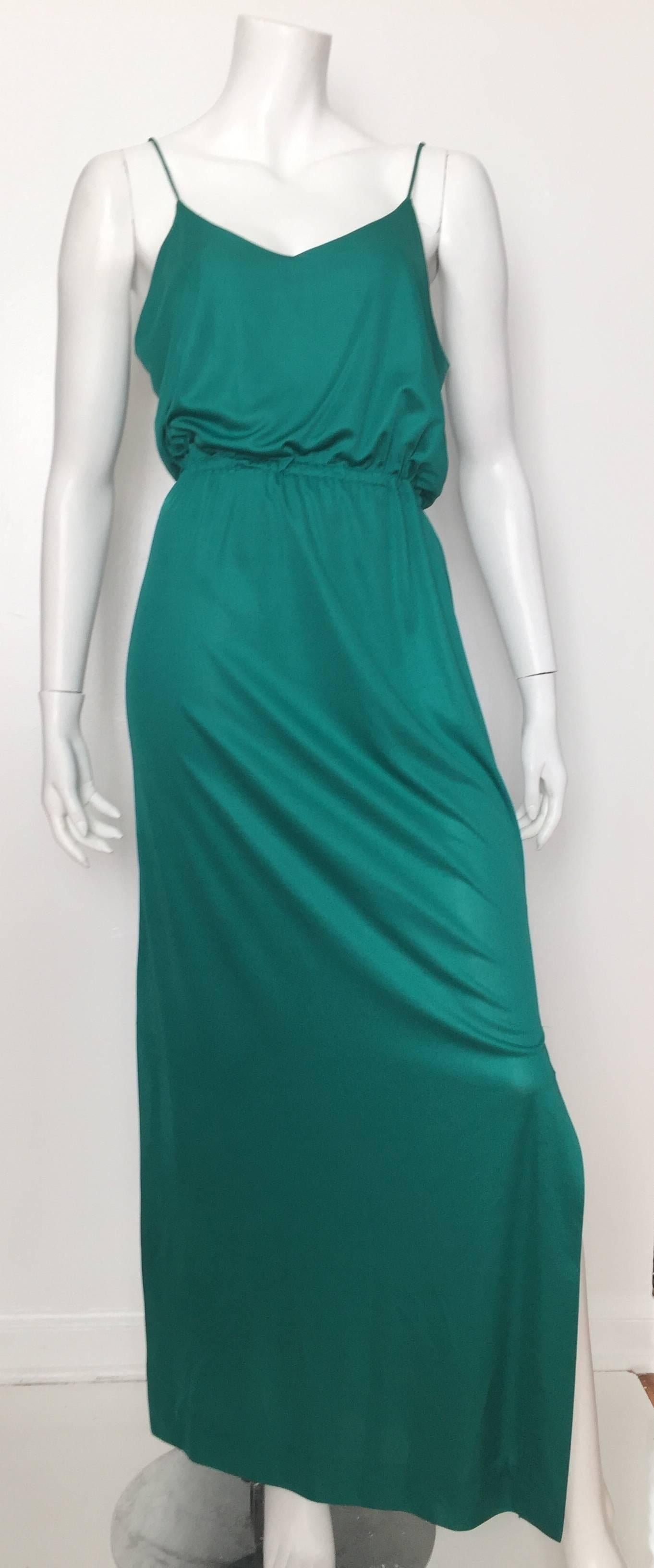 I.Magnin 1970s maxi emerald green spaghetti string dress and elastic waistband has matching dolman sleeves jacket will fit sizes 4 but please see & use measurements below so you know for certain this will fit you the way the paparazzi wants it
