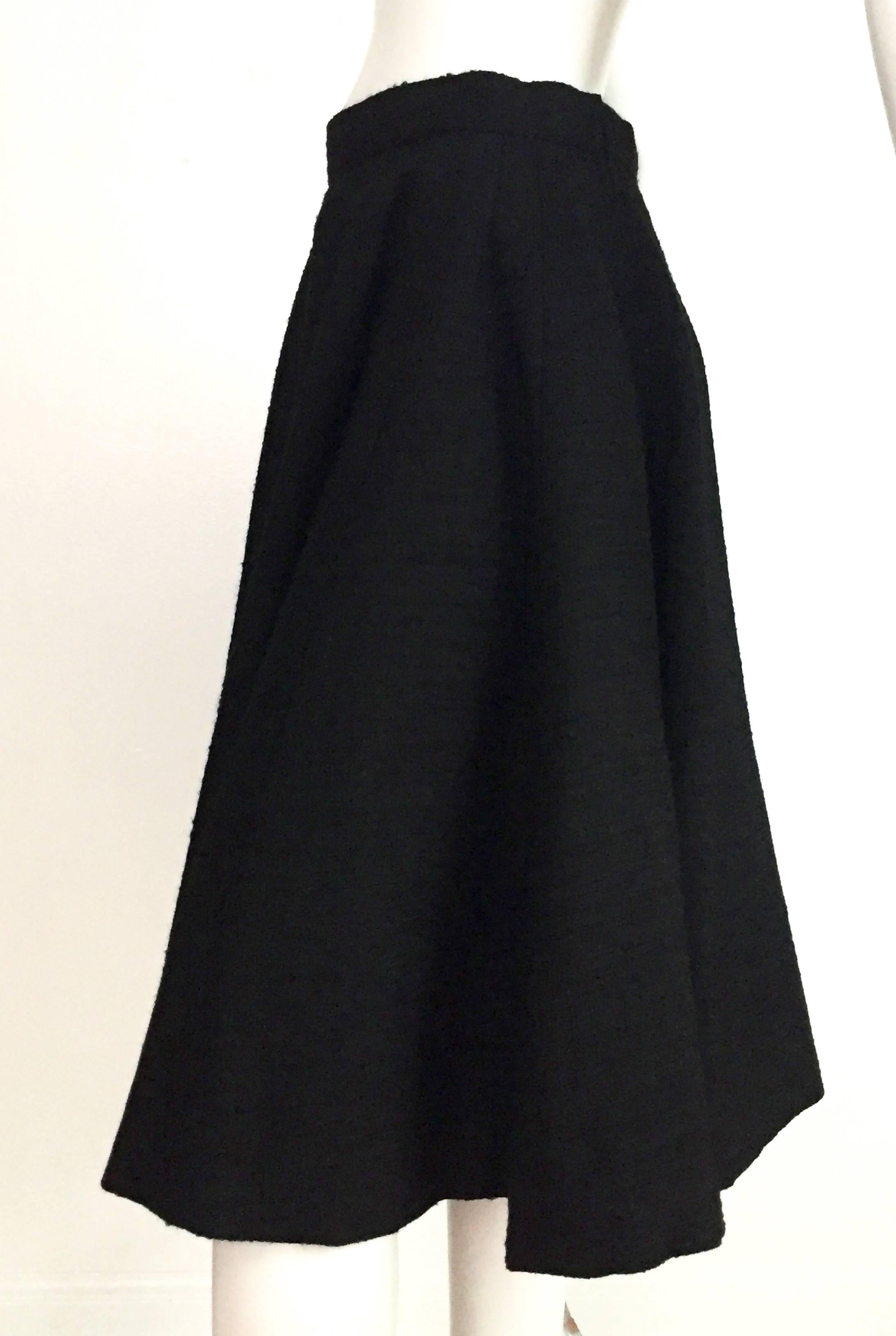 Norman Norell 1957 black nubby flare wool skirt will fit a size 6 / 8 because it is a high waisted skirt but please see & use measurements below so that you may properly measure your lovely body. Vertical panels compose this brilliantly constructed